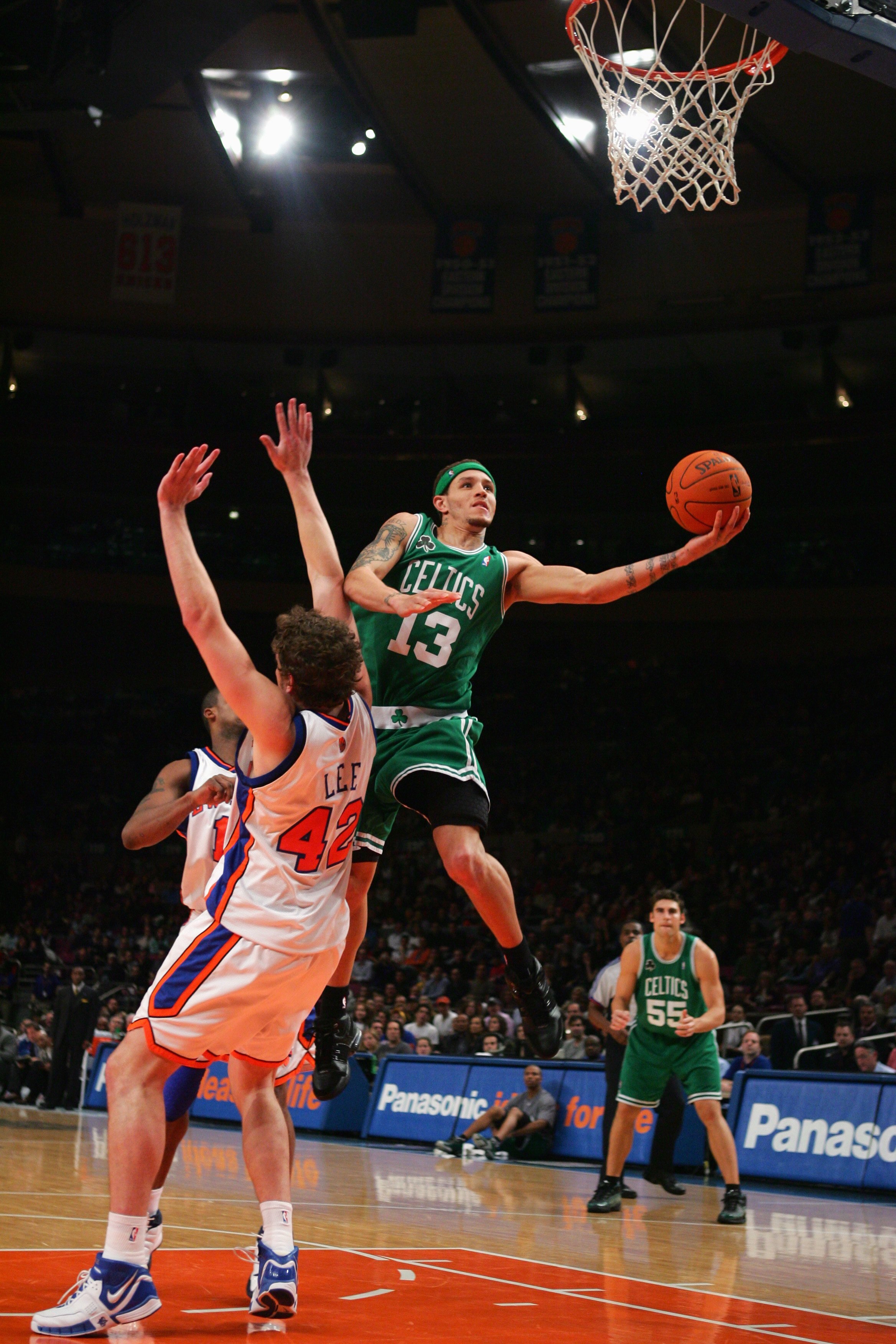 NEW YORK - NOVEMBER 18:  Delonte West #13 of the Boston Celtics shoots a layup against David Lee #42 of the New York Knicks during a game at Madison Square Garden on November 18, 2006 in New York City.  The Celtics won 122-118.  NOTE TO USER: User express
