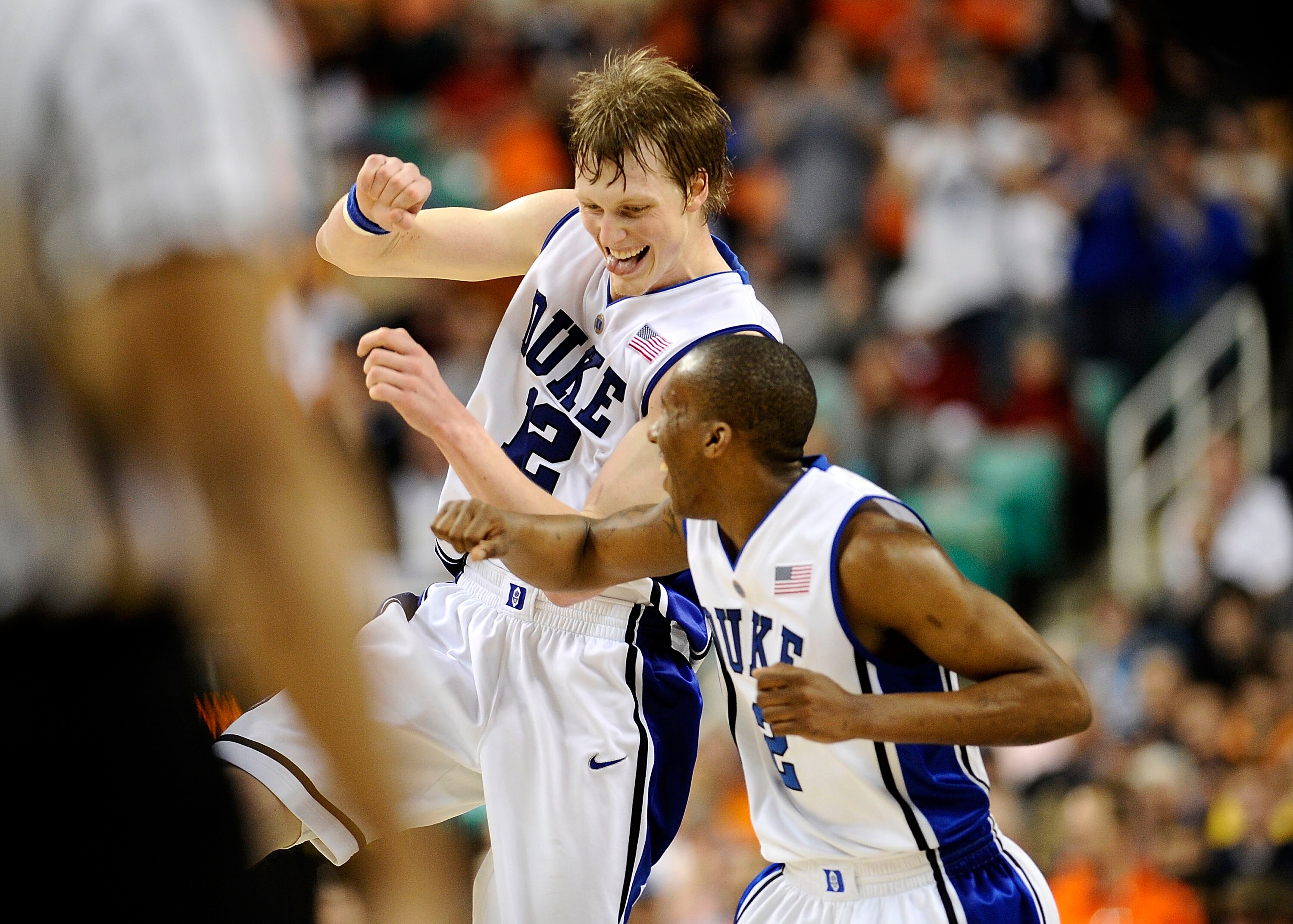 GREENSBORO, NC - MARCH 12:  Kyle Singler #12 and Nolan Smith #2 of the Duke Blue Devils celebrate during win over the University of Virginia Cavaliers in their quarterfinal game in the 2010 ACC Men's Basketball Tournament at the Greensboro Coliseum on Mar