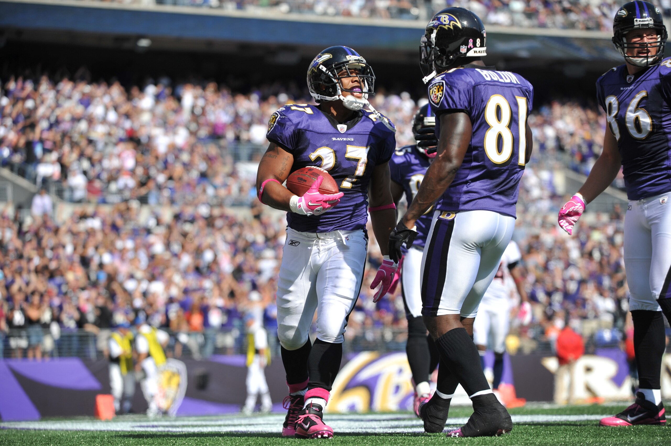 BALTIMORE, MD - OCTOBER 10: Ray Rice #27 of the Baltimore Ravens celebrates a touchdown against the Denver Broncos at M&T Bank Stadium on October 10, 2010 in Baltimore, Maryland. Players wore pink in recognition of Breast Cancer Awareness Month. The Raven