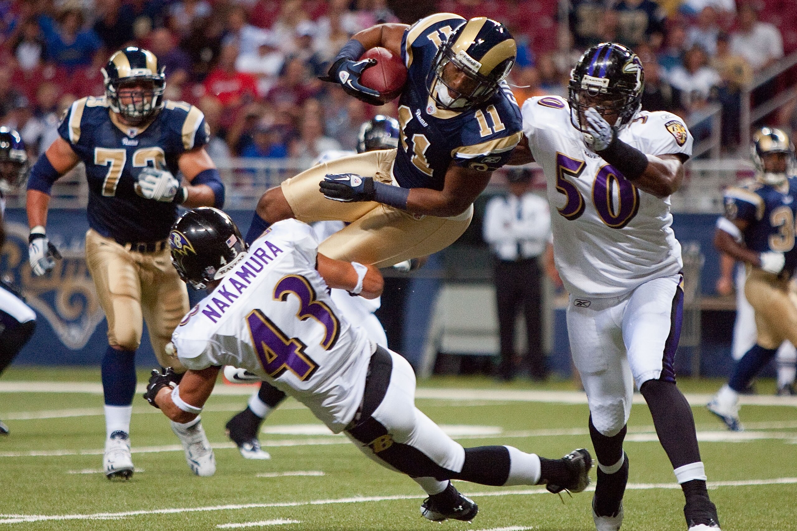 ST. LOUIS - SEPTEMBER 2: Brandon Gibson #11 of the St. Louis Rams looks to get over Haruki Nakamura #43 and Antwan Barnes #50 of the Baltimore Ravens during an NFL preseason game at the Edward Jones Dome on September 2, 2010 in St. Louis, Missouri. (Phot ST. LOUIS - SEPTEMBER 2: Brandon Gibson #11 of the St. Louis Rams looks to get over Haruki Nakamura #43 and Antwan Barnes #50 of the Baltimore Ravens during an NFL preseason game at the Edward Jones Dome on September 2, 2010 in St. Louis, Missouri. (Phot