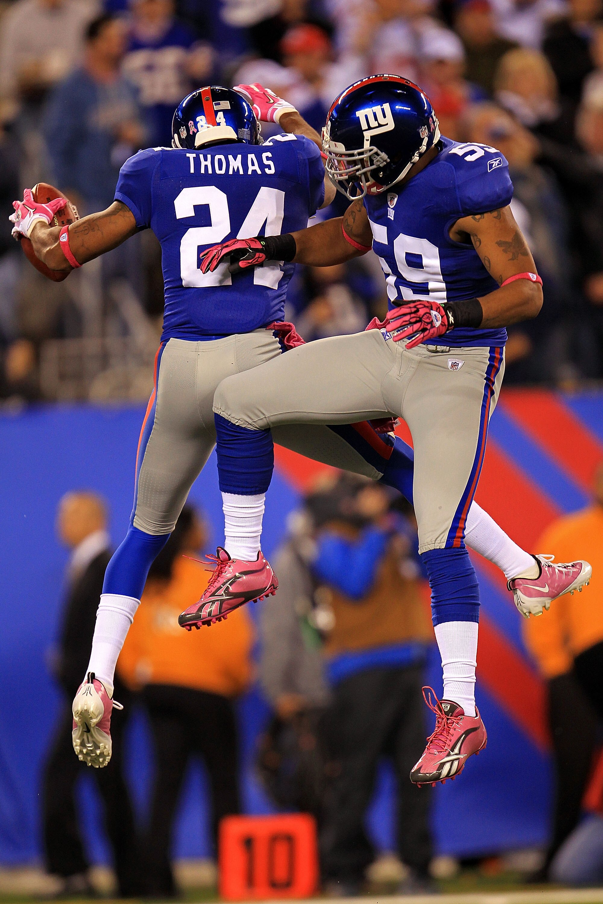 EAST RUTHERFORD, NJ - OCTOBER 03:  Terrell Thomas #24 of the New York Giants celebrates after an interception against the Chicago Bears with teammate Michael Boley #59 at New Meadowlands Stadium on October 3, 2010 in East Rutherford, New Jersey.  (Photo b
