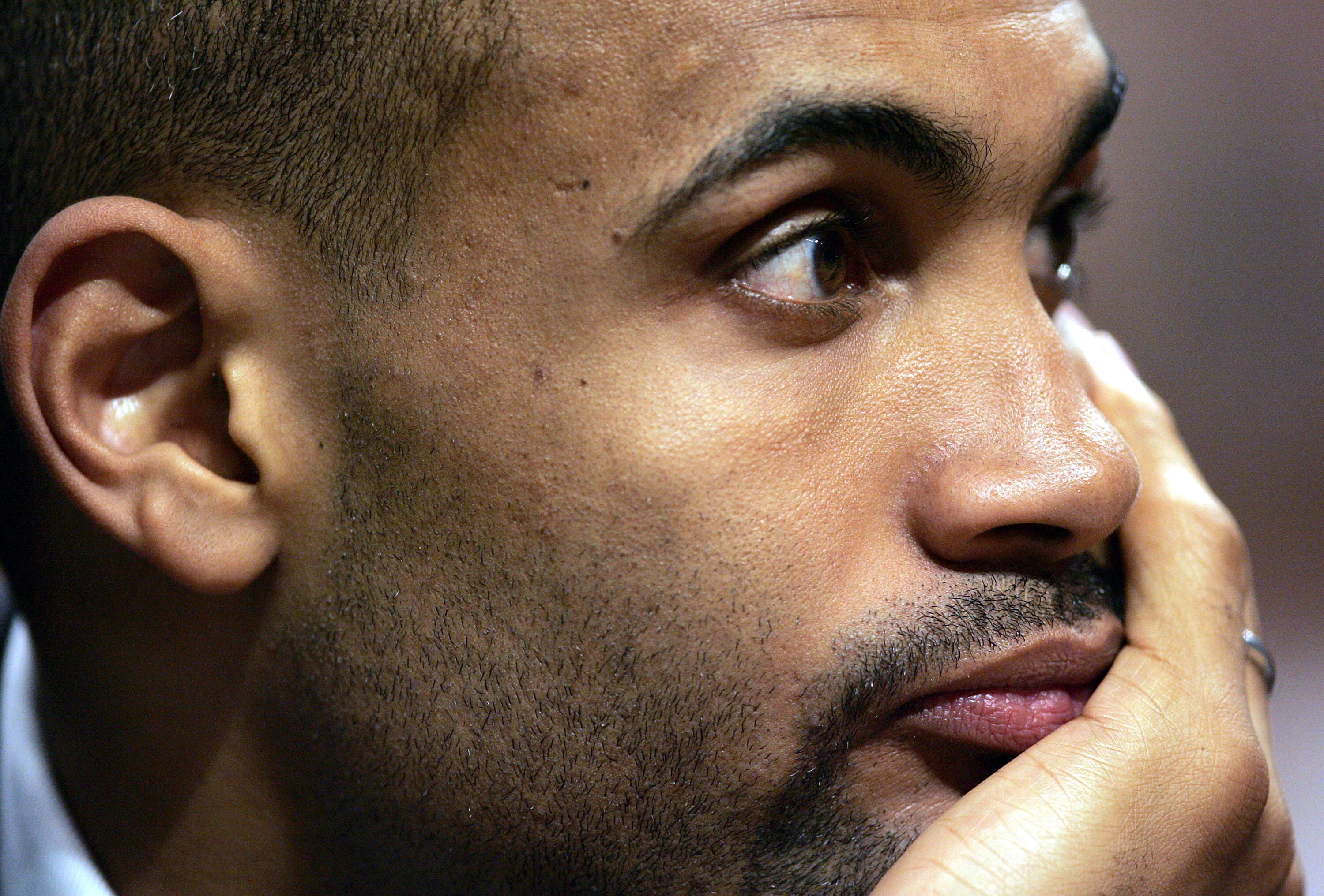 CHICAGO - APRIL 15:  Grant Hill of the Orlando Magic watches his team take on the Chicago Bulls from the bench on April 15, 2005 at the United Center in Chicago, Illinois. The Bulls defeated the Magic 117-77.  NOTE TO USER: User expressly acknowledges and