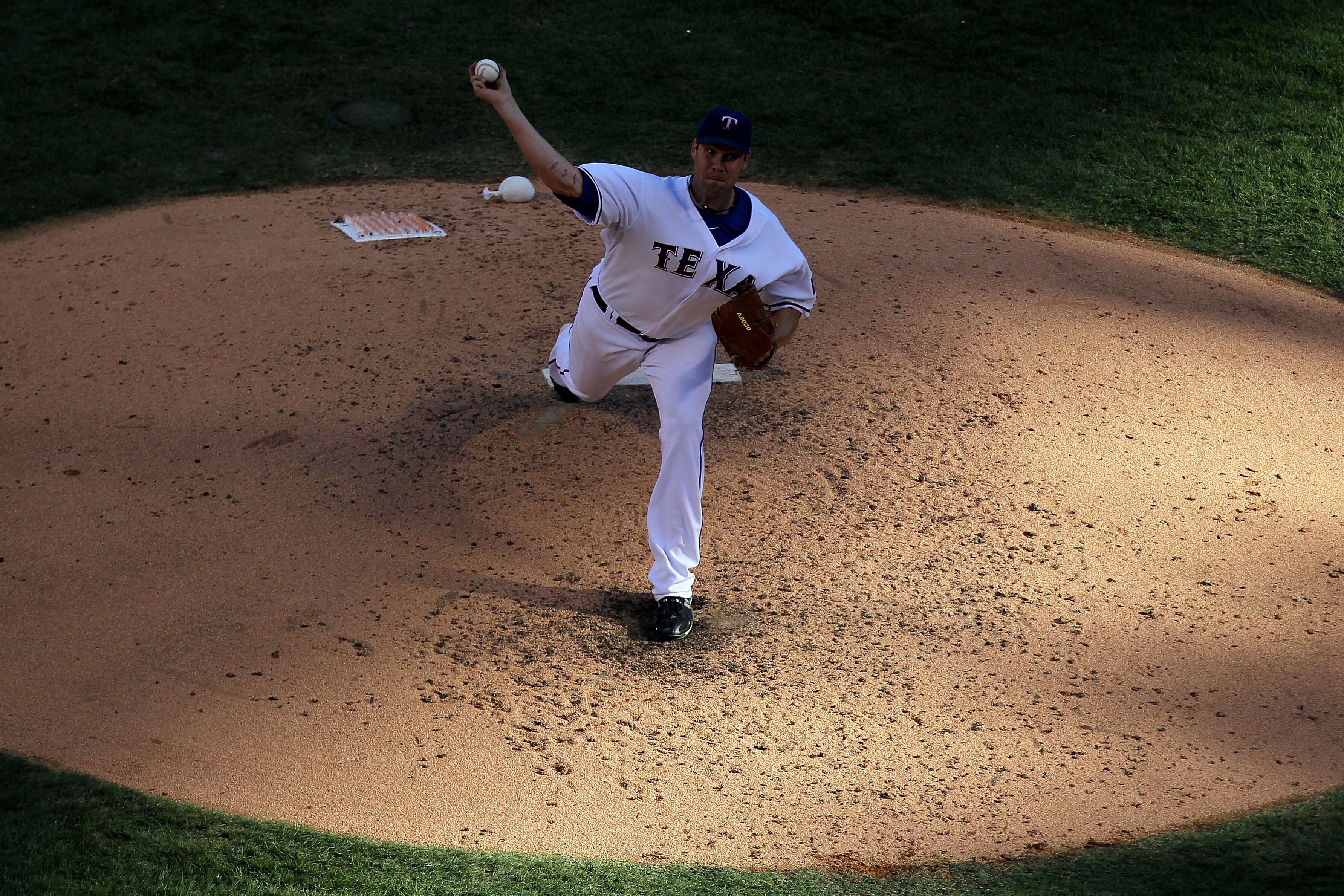 ARLINGTON, TX - OCTOBER 16:  Colby Lewis #48 of the Texas Rangers throws a pitch against the New York Yankees in Game Two of the ALCS during the 2010 MLB Playoffs at Rangers Ballpark in Arlington on October 16, 2010 in Arlington, Texas.  (Photo by Ronald 