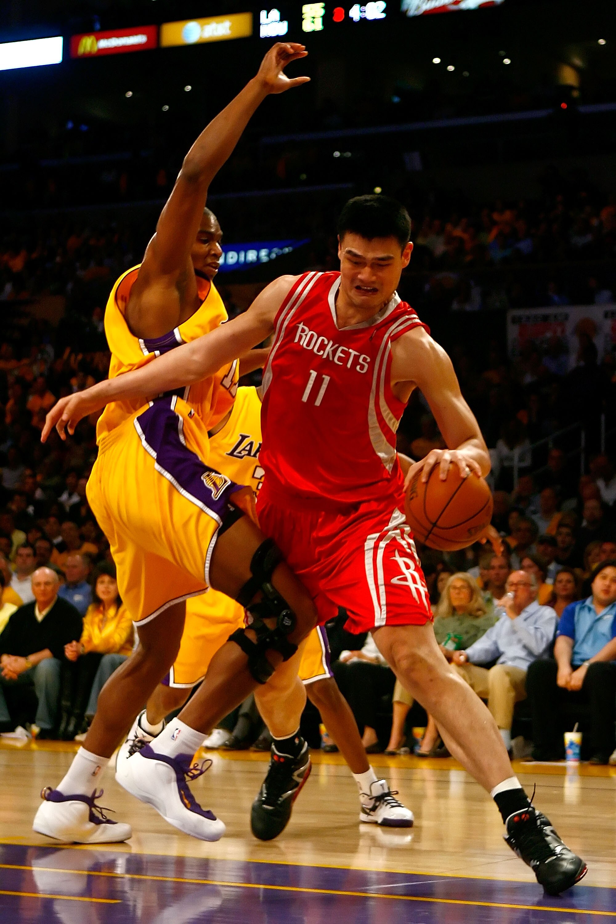 LOS ANGELES, CA - MAY 04:  Yao Ming #11 of the Houston Rockets drives on Andrew Bynum #17 of the Los Angeles Lakers in the second half of Game One of the Western Conference Semifinals during the 2009 NBA Playoffs at Staples Center on May 4, 2009 in Los An