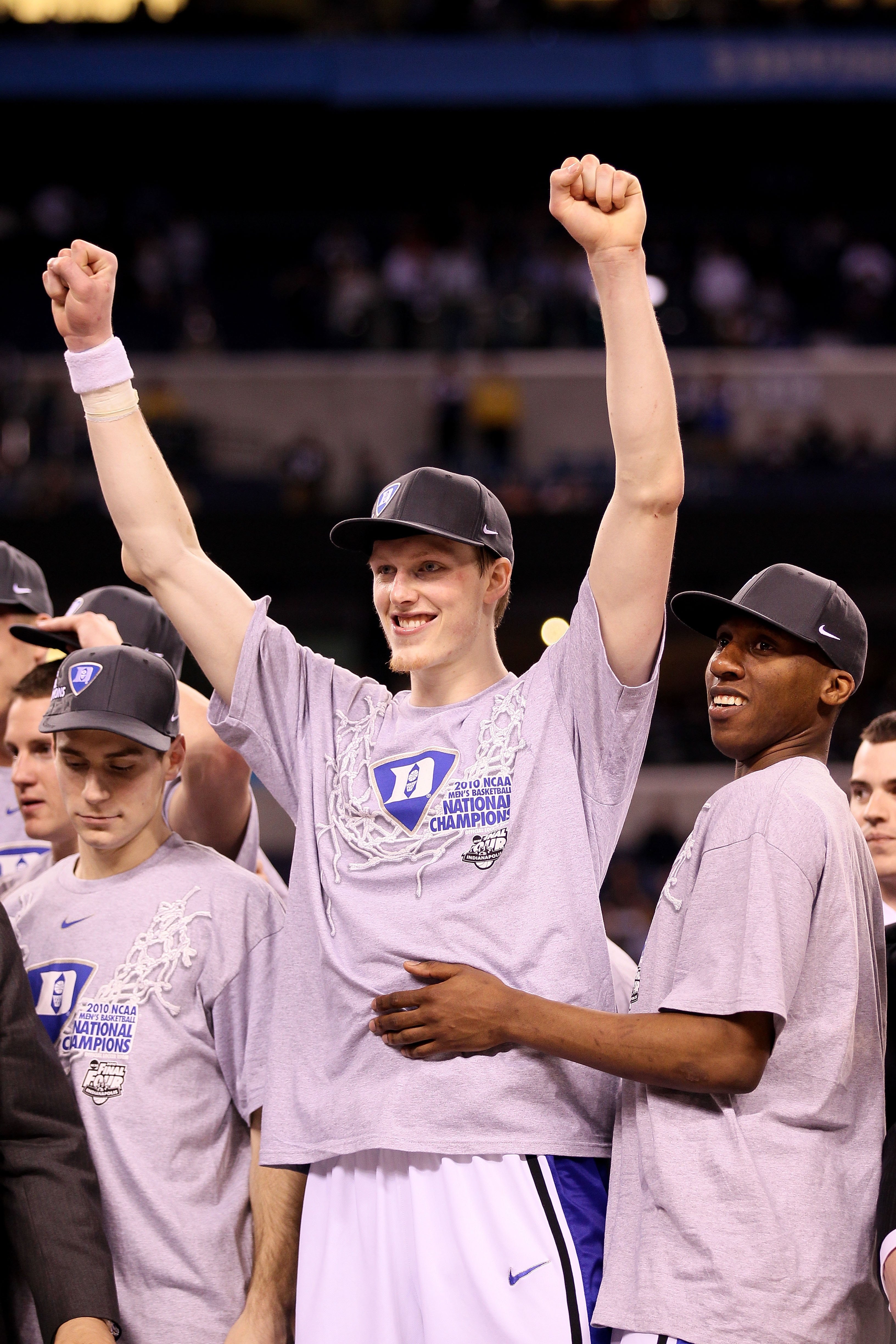 INDIANAPOLIS - APRIL 05:  Kyle Singler #12 and Nolan Smith #2 (R) of the Duke Blue Devils reacts as he celebrates after Duke won 61-59 against the Butler Bulldogs during the 2010 NCAA Division I Men's Basketball National Championship game at Lucas Oil Sta