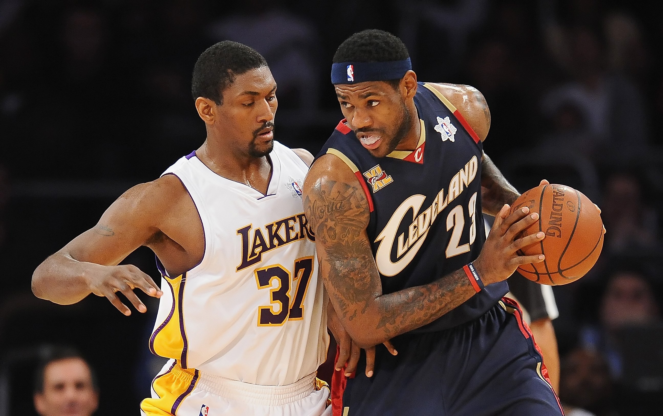 LOS ANGELES, CA - DECEMBER 25:  LeBron James #23 of the Cleveland Cavaliers drives against Ron Artest #37 of the Los Angeles Lakers at Staples Center on December 25, 2009 in Los Angeles, California. NOTE TO USER: User expressly acknowledges and agrees tha