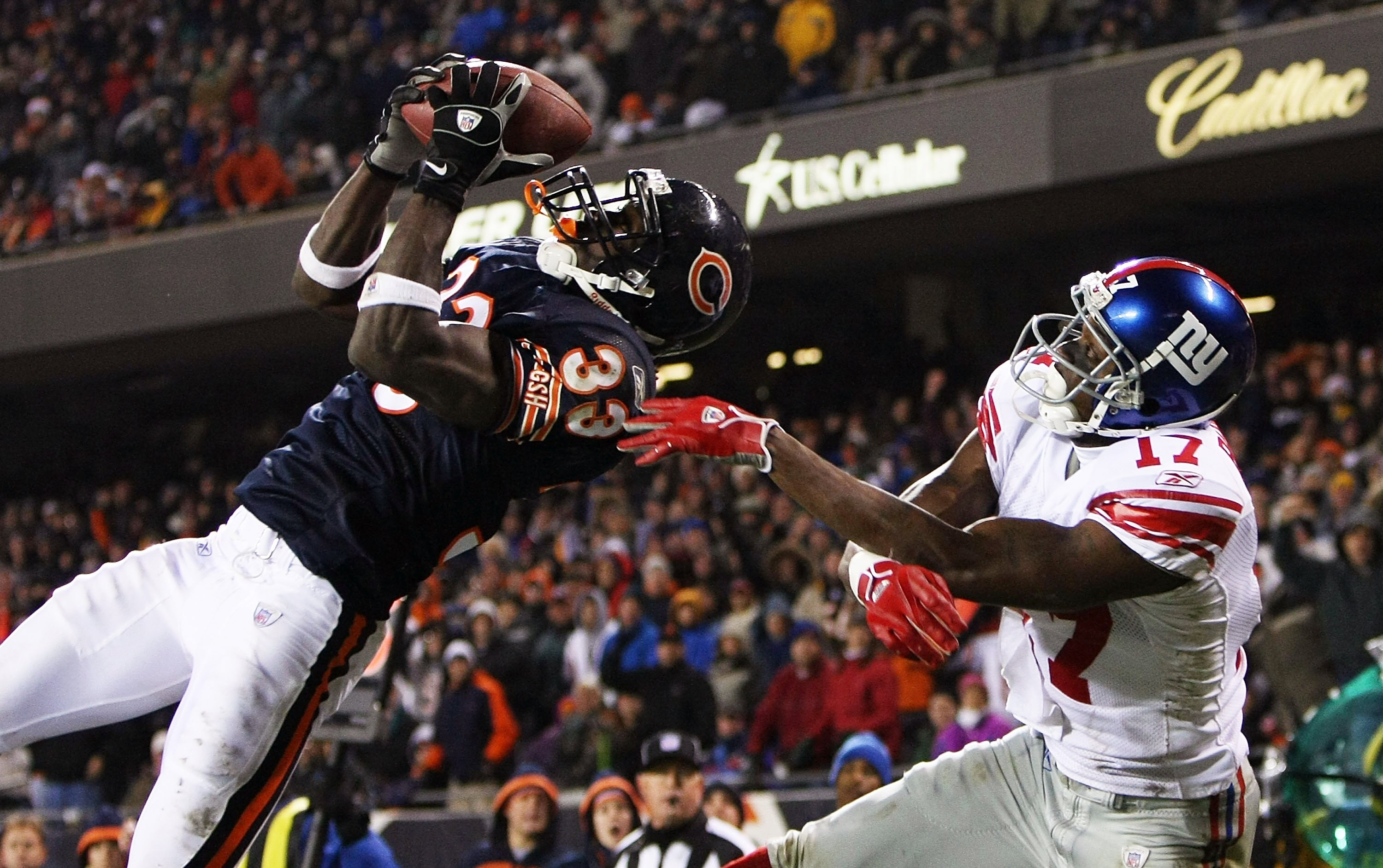 CHICAGO - DECEMBER 02: Charles Tillman #33 of the Chicago Bears intercepts a pass in the end zone intended for Plaxico Burress #17 of the New York Giants on December 2, 2007 at Soldier Field in Chicago, Illinois. The Giants defeated the Bears 21-16. (Phot