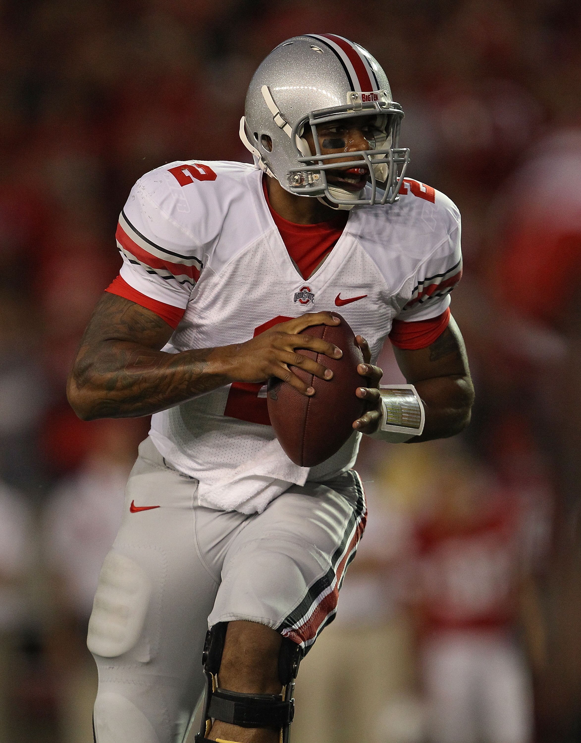 MADISON, WI - OCTOBER 16: Terrelle Pryor #2 of the Ohio State Buckeyes rolls out to look for a receiver against the Wisconsin Badgers at Camp Randall Stadium on October 16, 2010 in Madison, Wisconsin. (Photo by Jonathan Daniel/Getty Images)