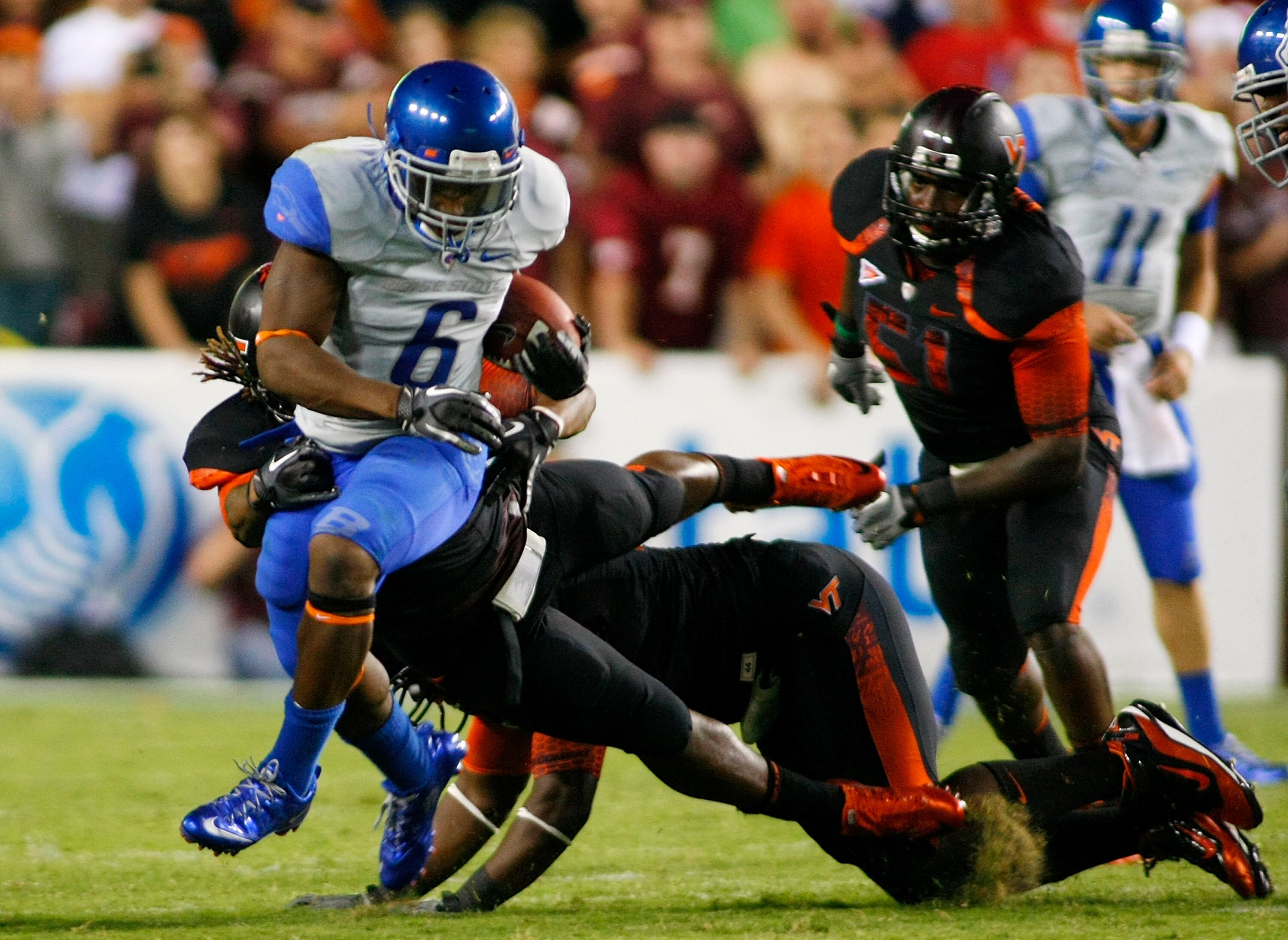 LANDOVER, MD - SEPTEMBER 06: Running back D.J. Harper #6 of the Boise State Broncos runs with the ball past linebacker Lyndell Gibson #44 of the Virginia Tech Hokies at FedExField on September 6, 2010 in Landover, Maryland. (Photo by Geoff Burke/Getty I LANDOVER, MD - SEPTEMBER 06: Running back D.J. Harper #6 of the Boise State Broncos runs with the ball past linebacker Lyndell Gibson #44 of the Virginia Tech Hokies at FedExField on September 6, 2010 in Landover, Maryland. (Photo by Geoff Burke/Getty I