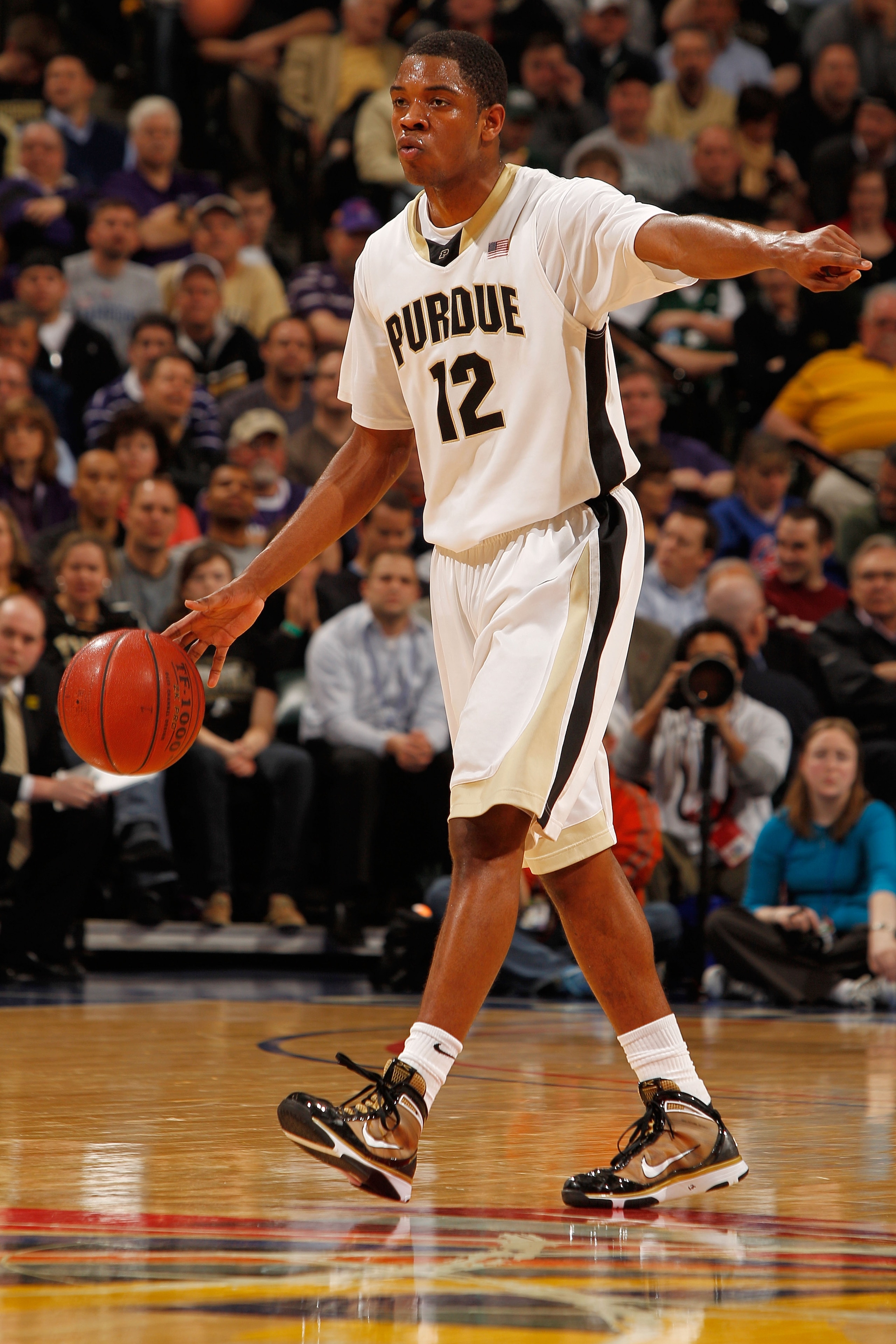 INDIANAPOLIS - MARCH 12:  Kelsey Barlow #12 of the Purdue Boilermakers dribbles the ball against the Northwestern Wildcats during the quarterfinals of the Big Ten Men's Basketball Tournament at Conseco Fieldhouse on March 12, 2010 in Indianapolis, Indiana