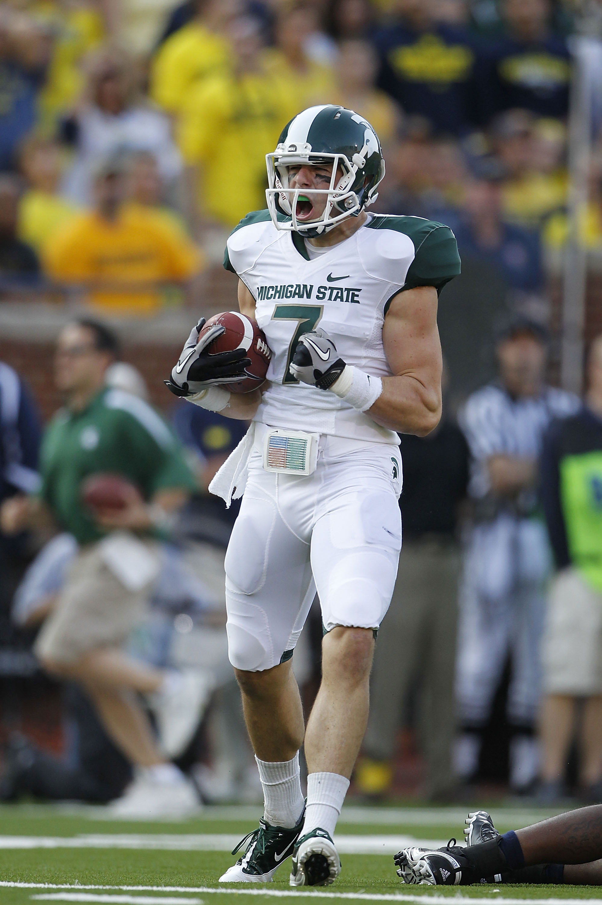 ANN ARBOR, MI - OCTOBER 09:  Steve Nichol #7 of the Michigan State Spartans celebrates a 42 yard pass compleation from Kirk Cousins #8 during the third quarter of the game against the Michigan Wolverines on October 9, 2010 at Michigan Stadium in Ann Arbor