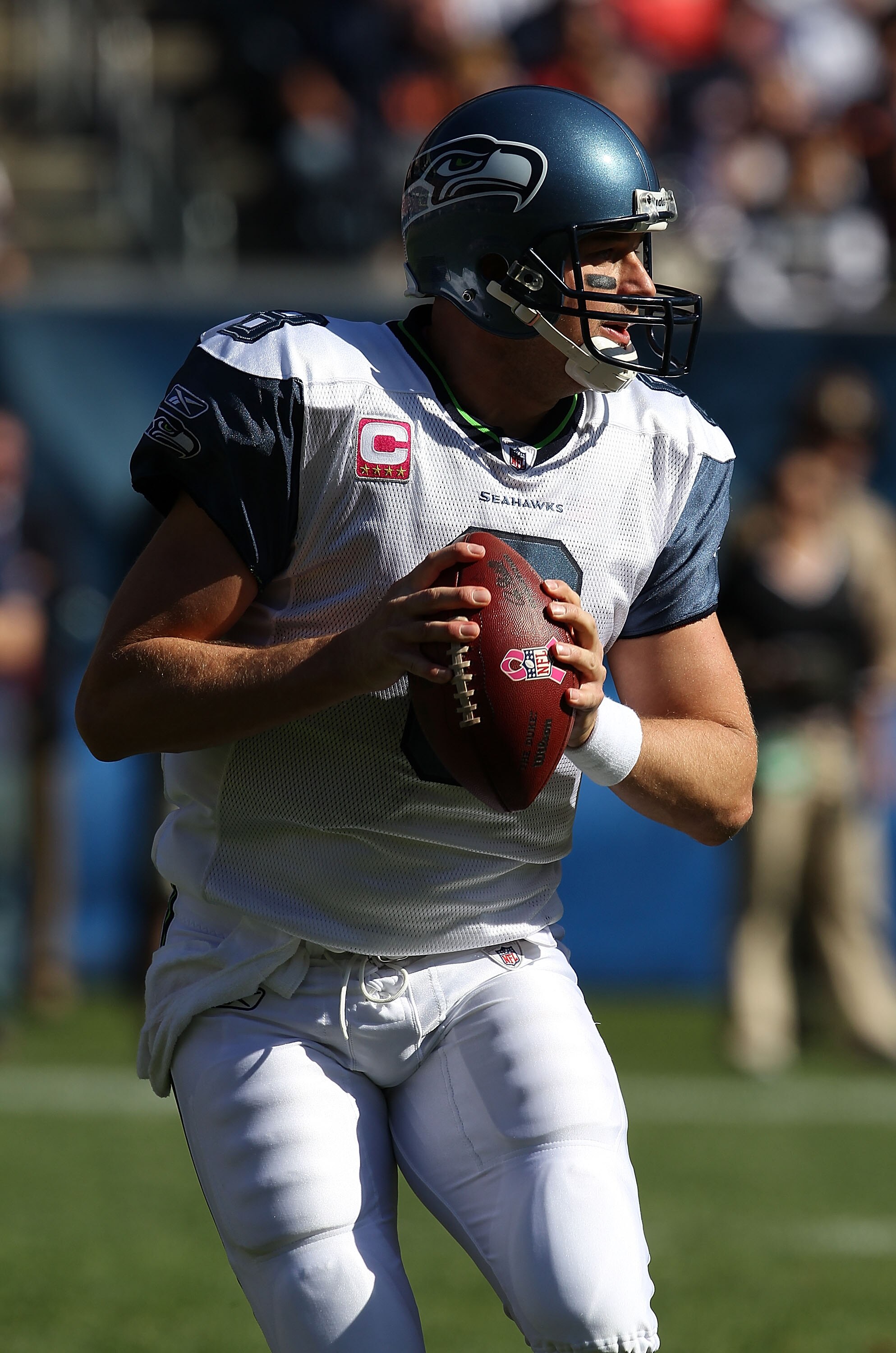CHICAGO - OCTOBER 17: Matt Hasselbeck #8 of the Seattle Seahawks looks for a receiver against the Chicago Bears at Soldier Field on October 17, 2010 in Chicago, Illinois. The Seahawks defeated the Bears 23-20. (Photo by Jonathan Daniel/Getty Images)