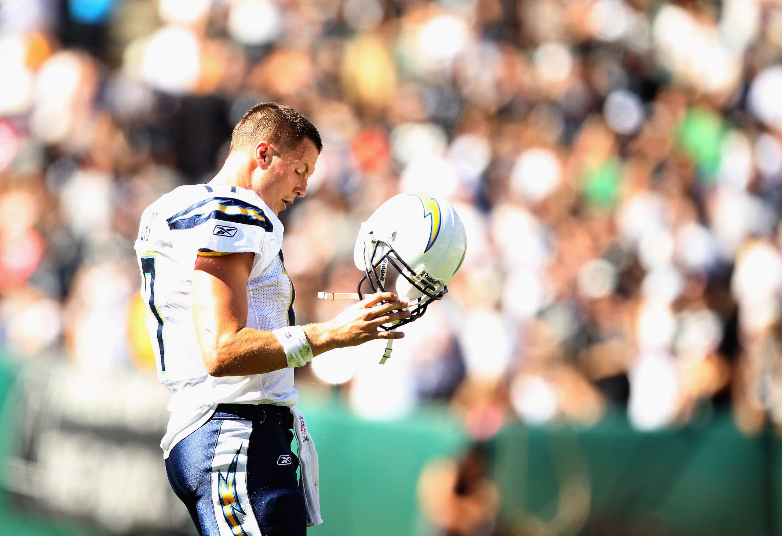 OAKLAND, CA - OCTOBER 10:  Philip Rivers #17 of the San Diego Chargers walks off the field after the Chargers fumbled the ball against the Oakland Raiders at Oakland-Alameda County Coliseum on October 10, 2010 in Oakland, California.  (Photo by Ezra Shaw/