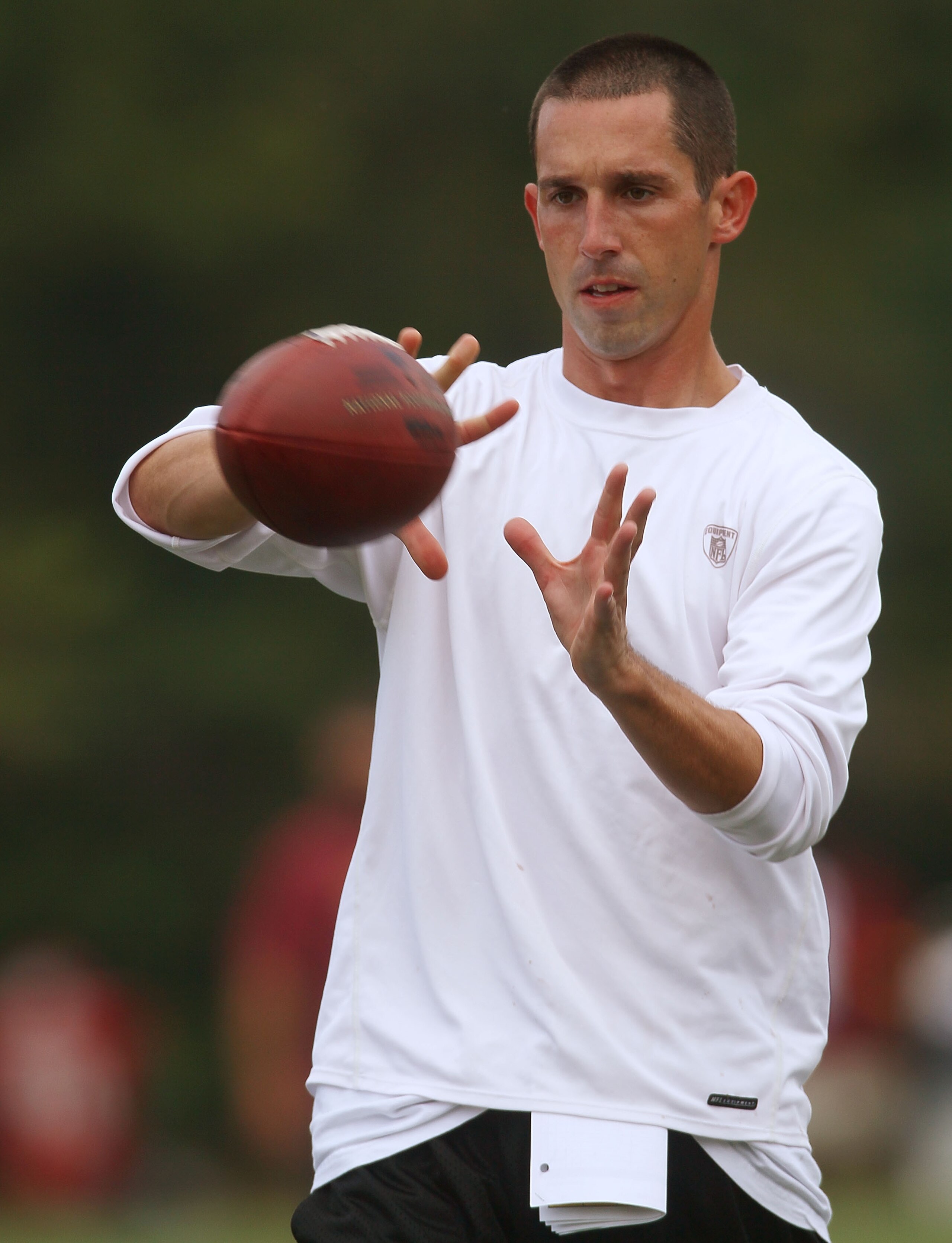 ASHBURN, VA - JULY 29: Offensive Coordinator Kyle Shanahan of the Washington Redskins catches a pass during drills on the first day of training camp July 29, 2010 in Ashburn, Virginia. (Photo by Win McNamee/Getty Images) ASHBURN, VA - JULY 29: Offensive Coordinator Kyle Shanahan of the Washington Redskins catches a pass during drills on the first day of training camp July 29, 2010 in Ashburn, Virginia. (Photo by Win McNamee/Getty Images)