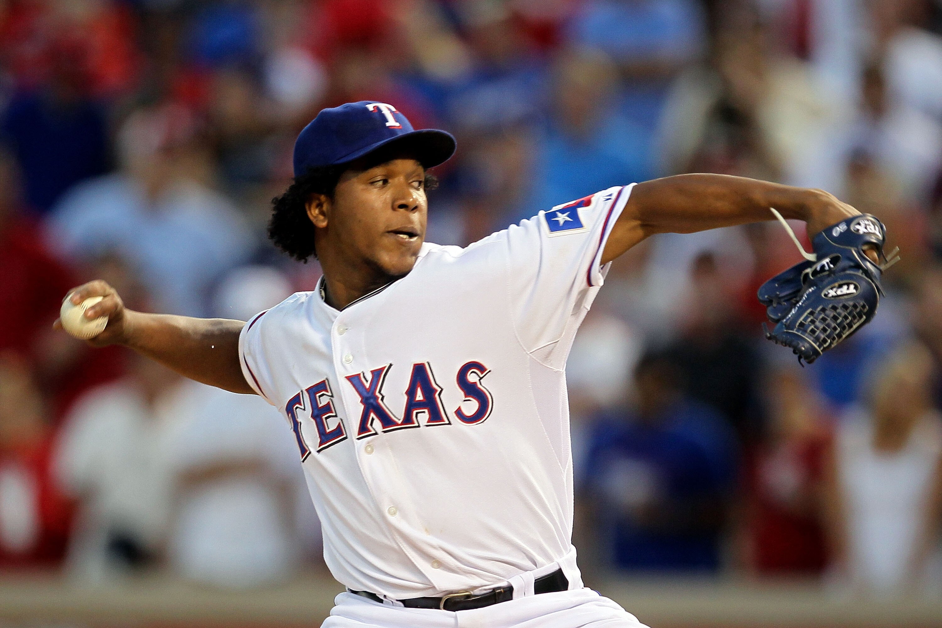 ARLINGTON, TX - OCTOBER 16:  Neftali Feliz #30 of the Texas Rangers pitches against the New York Yankees in Game Two of the ALCS during the 2010 MLB Playoffs at Rangers Ballpark in Arlington on October 16, 2010 in Arlington, Texas.  (Photo by Stephen Dunn