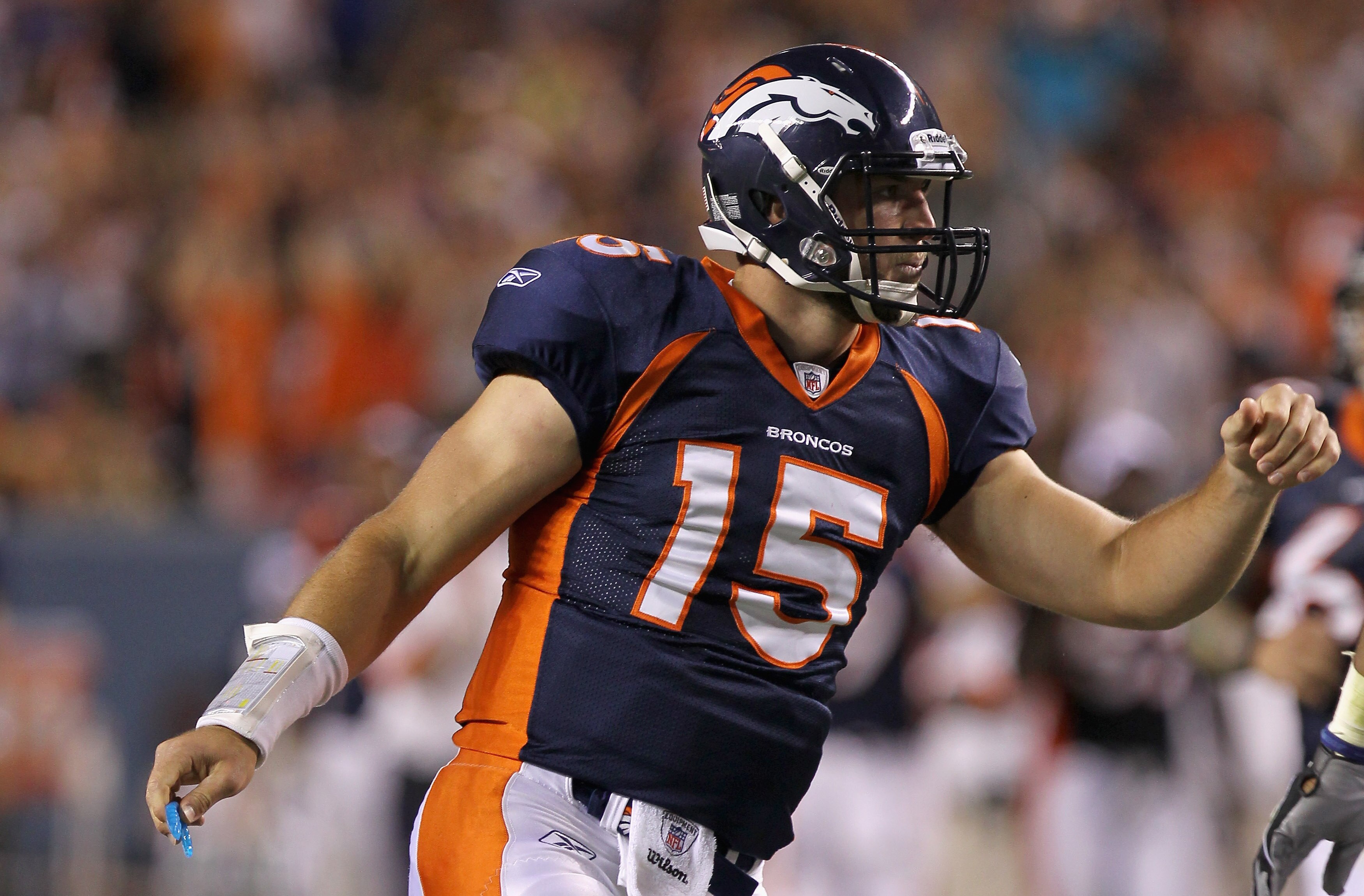 DENVER - AUGUST 29:  Quarterback Tim Tebow #15 of the Denver Broncos celebrates his fourth quarter touchdown pass to Eric Decker against the Pittsburgh Steelers during preseason NFL action at INVESCO Field at Mile High on August 29, 2010 in Denver, Colora