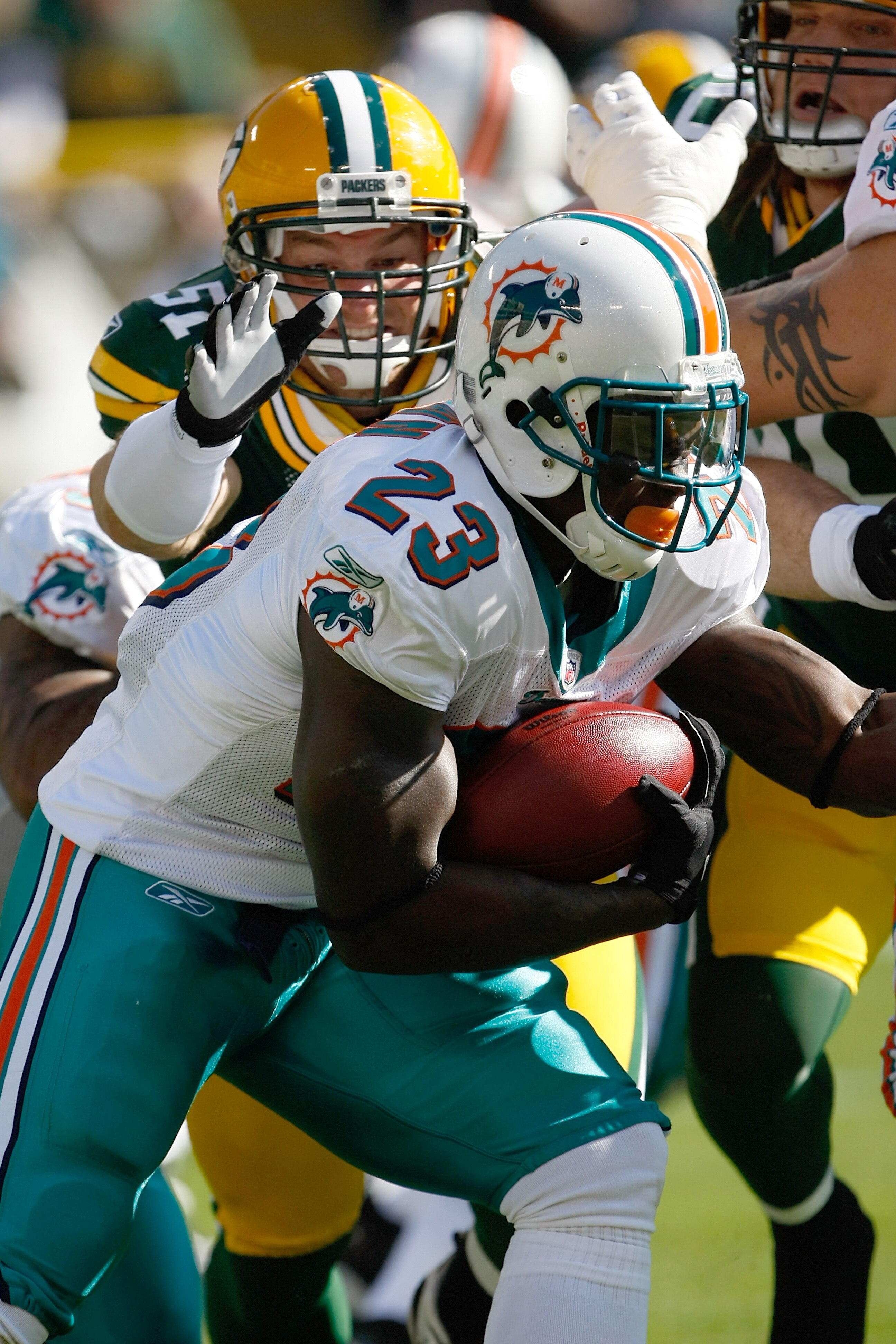 GREEN BAY, WI - OCTOBER 17: Ronnie Brown #23 of the Miami Dolphins runs against the Green Bay Packers at Lambeau Field on October 17, 2010 in Green Bay, Wisconsin. (Photo by Scott Boehm/Getty Images)