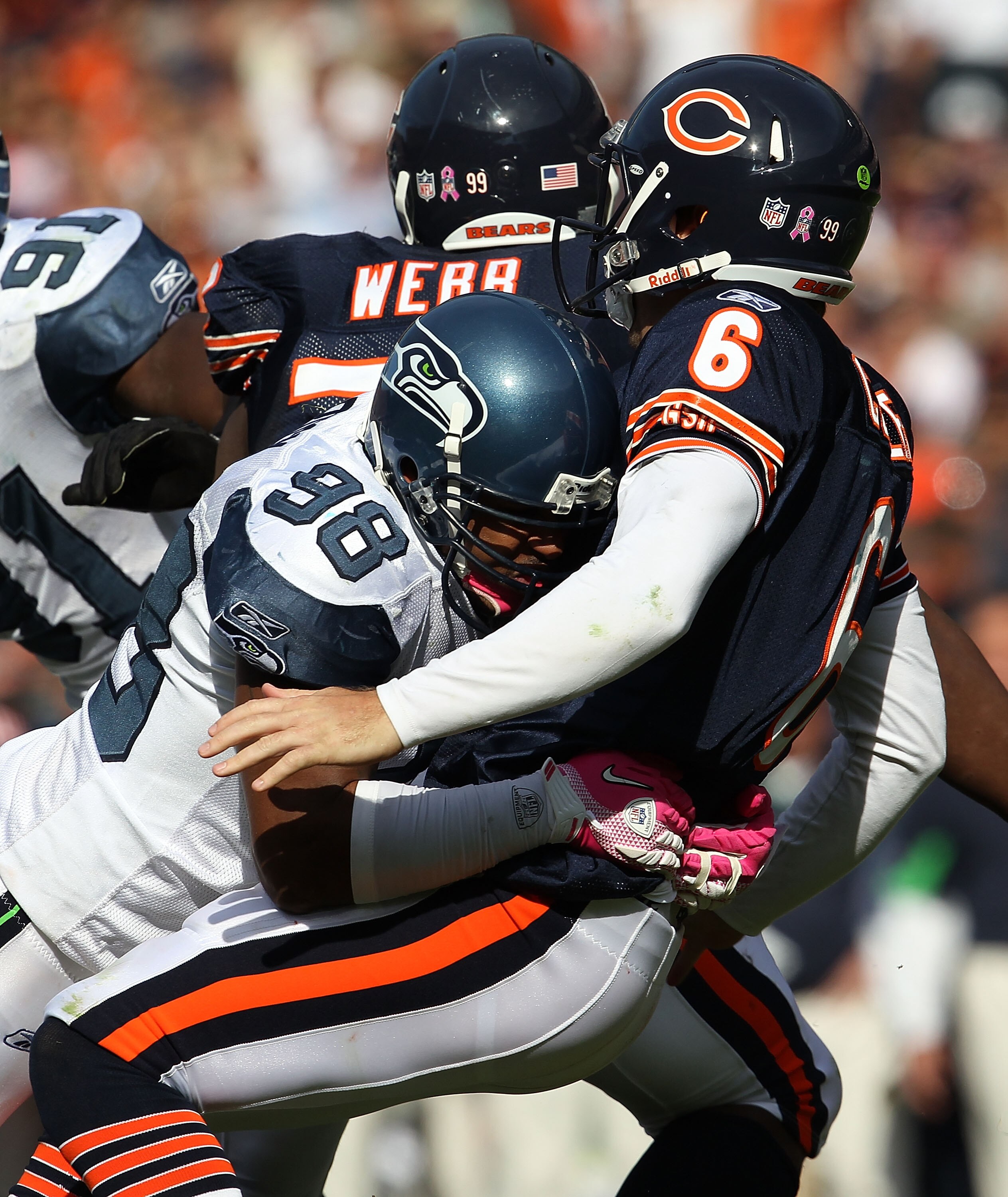 CHICAGO - OCTOBER 17: Jay Cutler #6 of the Chicago Bears is hit after throwing by Raheem Brock #98 of the Seattle Seahawks at Soldier Field on October 17, 2010 in Chicago, Illinois. The Seahawks defeated the Bears 23-20. (Photo by Jonathan Daniel/Getty Im