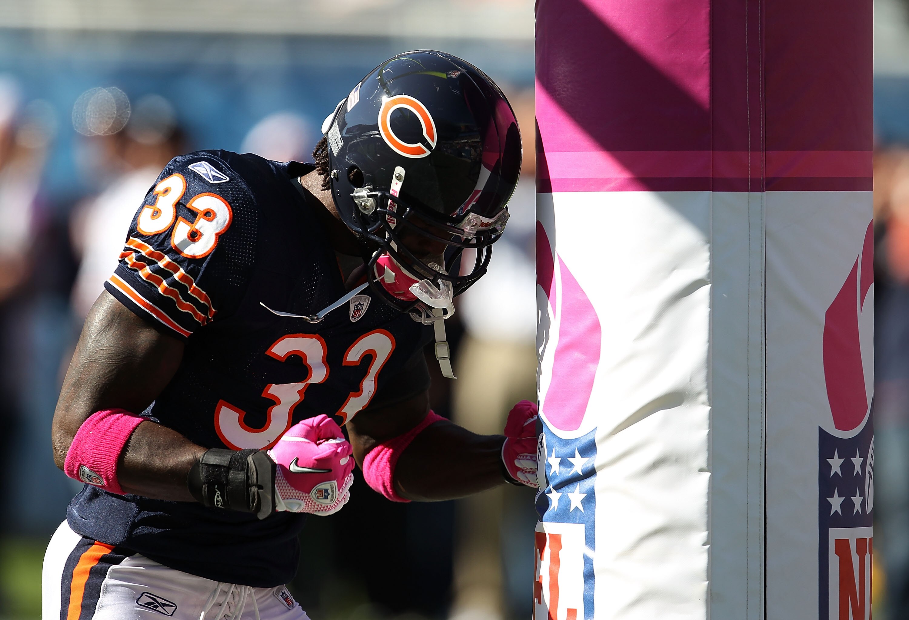 CHICAGO - OCTOBER 17: Charles Tillman #33 of the Chicago Bears uses the goal post as a punching bag during warm-ups before a game against the Seattle Seahawks at Soldier Field on October 17, 2010 in Chicago, Illinois. (Photo by Jonathan Daniel/Getty Image
