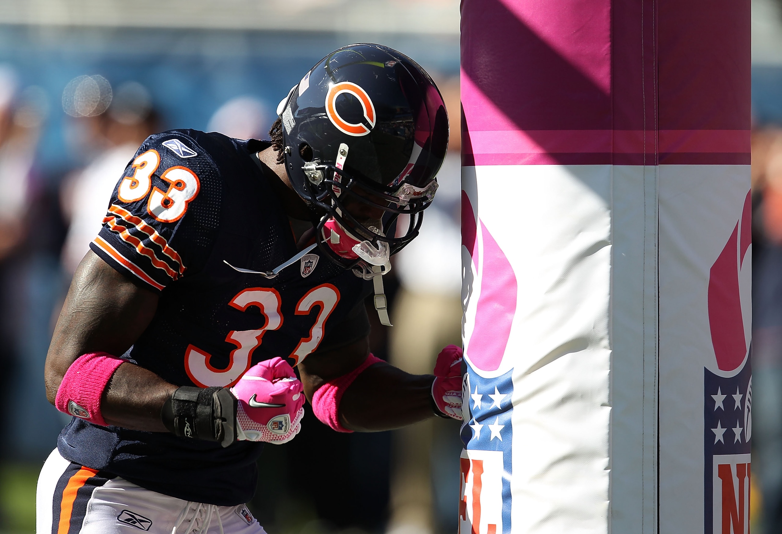 CHICAGO - OCTOBER 17: Charles Tillman #33 of the Chicago Bears uses the goal post as a punching bag during warm-ups before a game against the Seattle Seahawks at Soldier Field on October 17, 2010 in Chicago, Illinois. (Photo by Jonathan Daniel/Getty Image