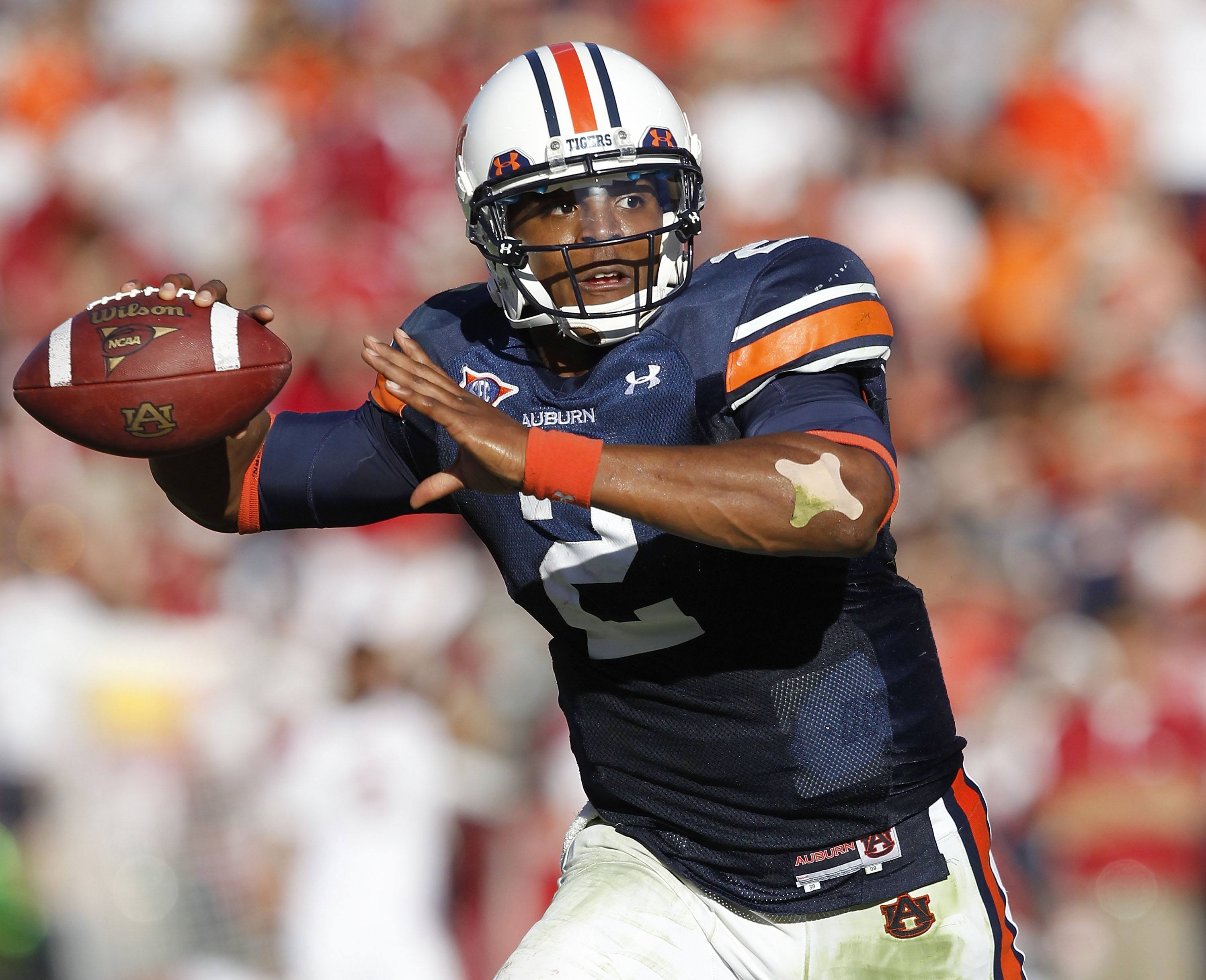 AUBURN, AL - OCTOBER 16:  Quarterback Cam Newton #2 of the Auburn Tigers throws a pass during the game against the Arkansas Razorbacks at Jordan-Hare Stadium on October 16, 2010 in Auburn, Alabama.  (Photo by Mike Zarrilli/Getty Images)