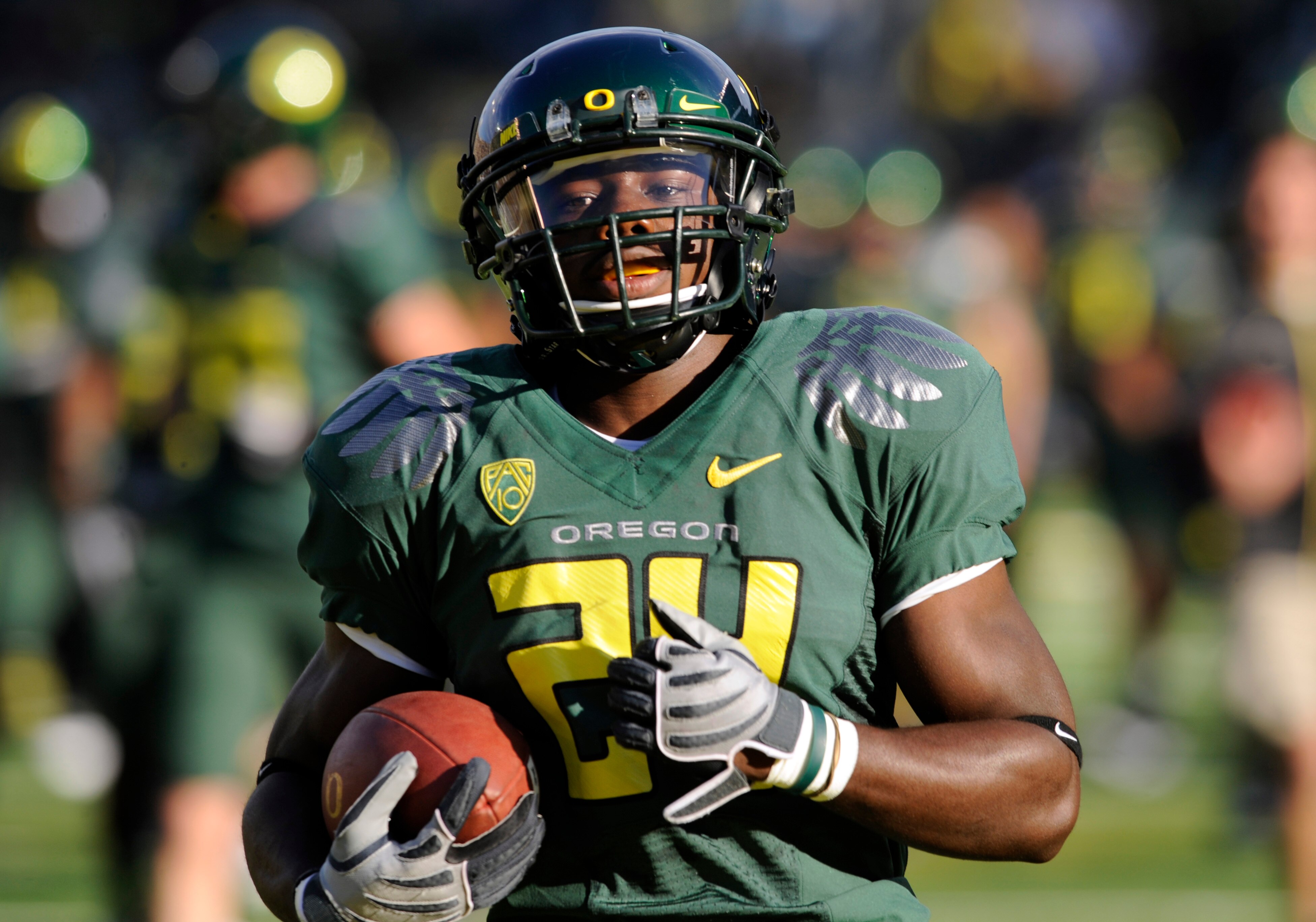 EUGENE, OR - OCTOBER 2: Running back Kenjon Barner #24 of the Oregon Ducks runs with the ball during warmups before the game against the Stanford Cardinal at Autzen Stadium on October 2, 2010 in Eugene, Oregon. Oregon won the game 52-31. (Photo by Steve D