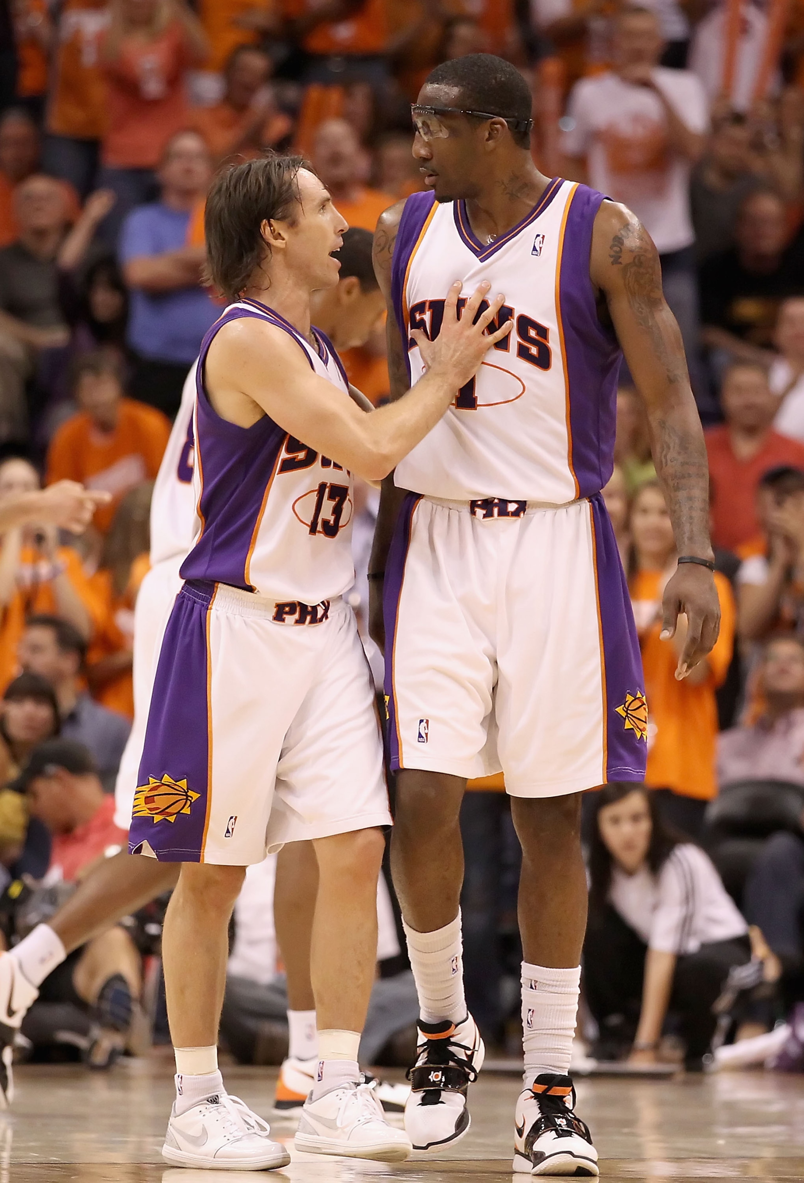 PHOENIX - MAY 03:  Steve Nash #13 and Amar'e Stoudemire #1 of the Phoenix Suns talk during Game One of the Western Conference Semifinals of the 2010 NBA Playoffs against the San Antonio Spurs at US Airways Center on May 3, 2010 in Phoenix, Arizona. The Su