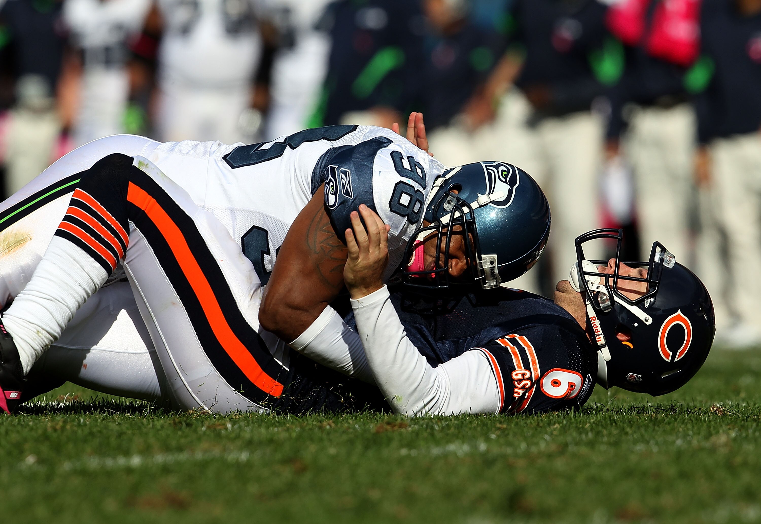 CHICAGO - OCTOBER 17: Jay Cutler #6 of the Chicago Bears is driven to the ground after throwing by Raheem Brock #98 of the Seattle Seahawks at Soldier Field on October 17, 2010 in Chicago, Illinois. The Seahawks defeated the Bears 23-20. (Photo by Jonatha