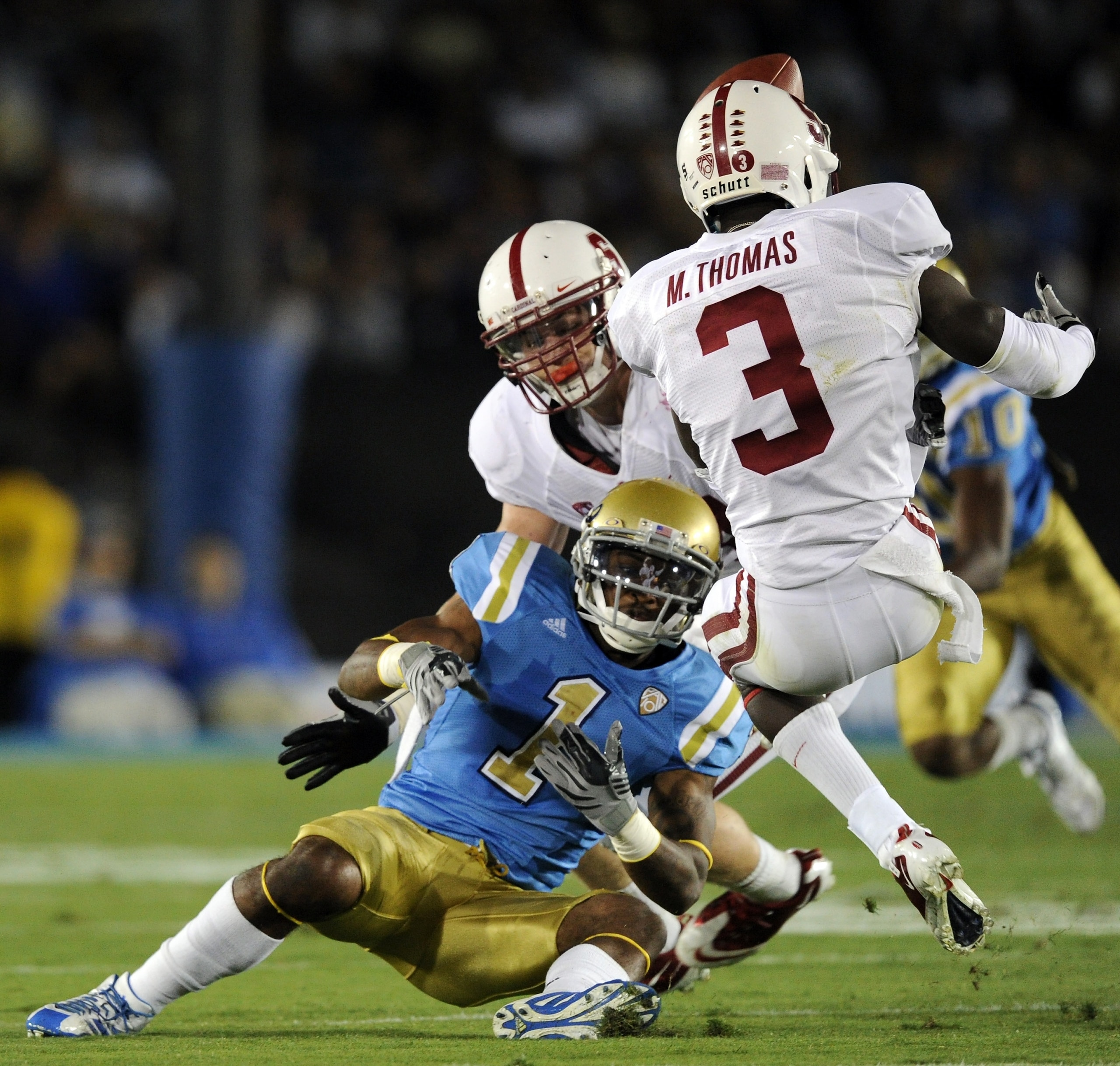 PASADENA, CA - SEPTEMBER 11:  Randall Carroll #1 of UCLA is stripped of the ball by Michael Thomas #3 and Chase Thomas #44 of Stanford during the first quarter at Rose Bowl on September 11, 2010 in Pasadena, California.  (Photo by Harry How/Getty Images)