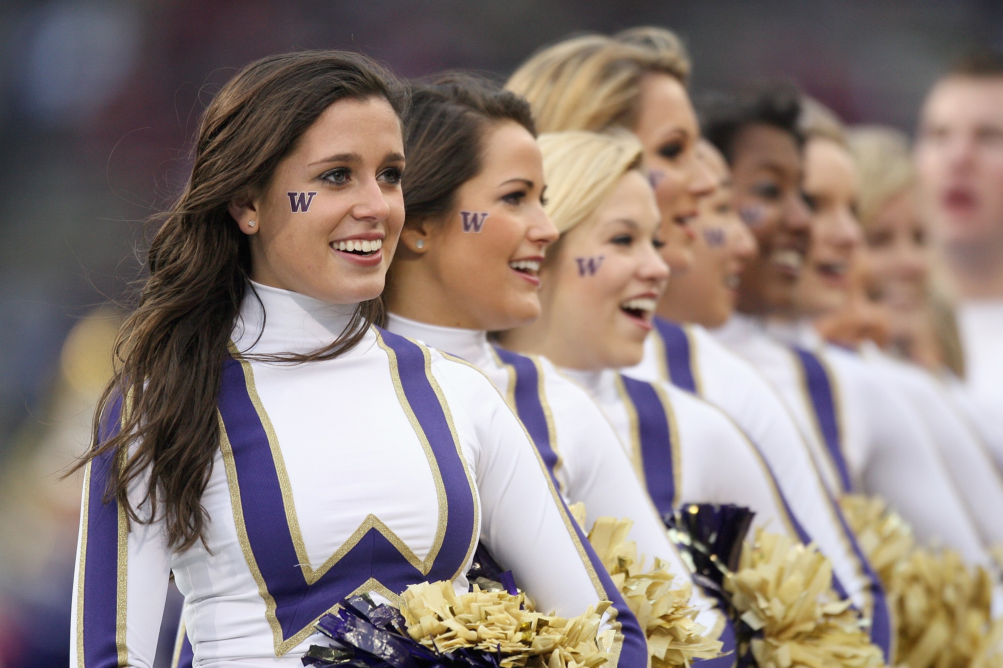 SEATTLE - NOVEMBER 28: Washington Huskies cheerleaders perform during the Apple Cup game against the Washington State Cougars on November 28, 2009 at Husky Stadium in Seattle, Washington. The Huskies defeated the Cougars 30-0. (Photo by Otto Greule Jr/Get