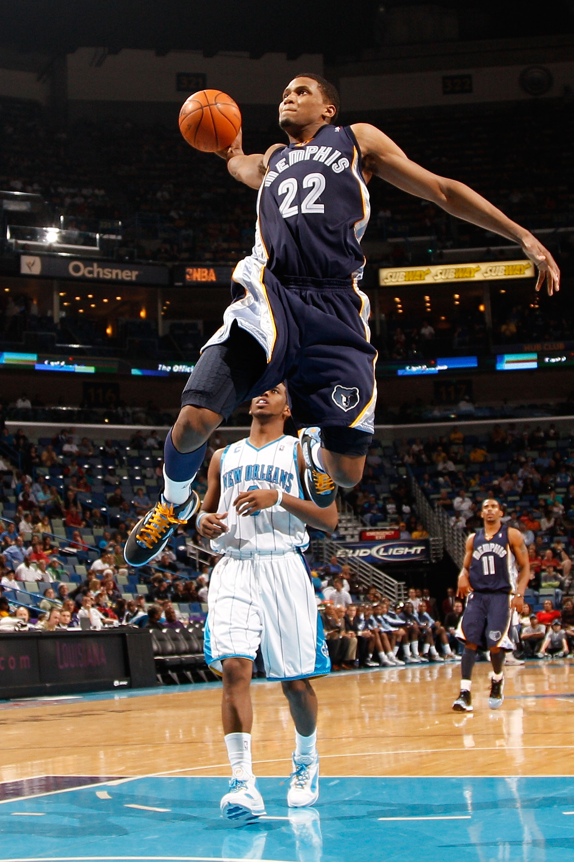 NEW ORLEANS - JANUARY 20:  Rudy Gay #22 of the Memphis Grizzlies goes up for a dunk over Chris Paul #3 of the New Orleans Hornets at the New Orleans Arena on January 20, 2010 in New Orleans, Louisiana.  The Hornets defeated the Grizzlies 113-111.  NOTE TO