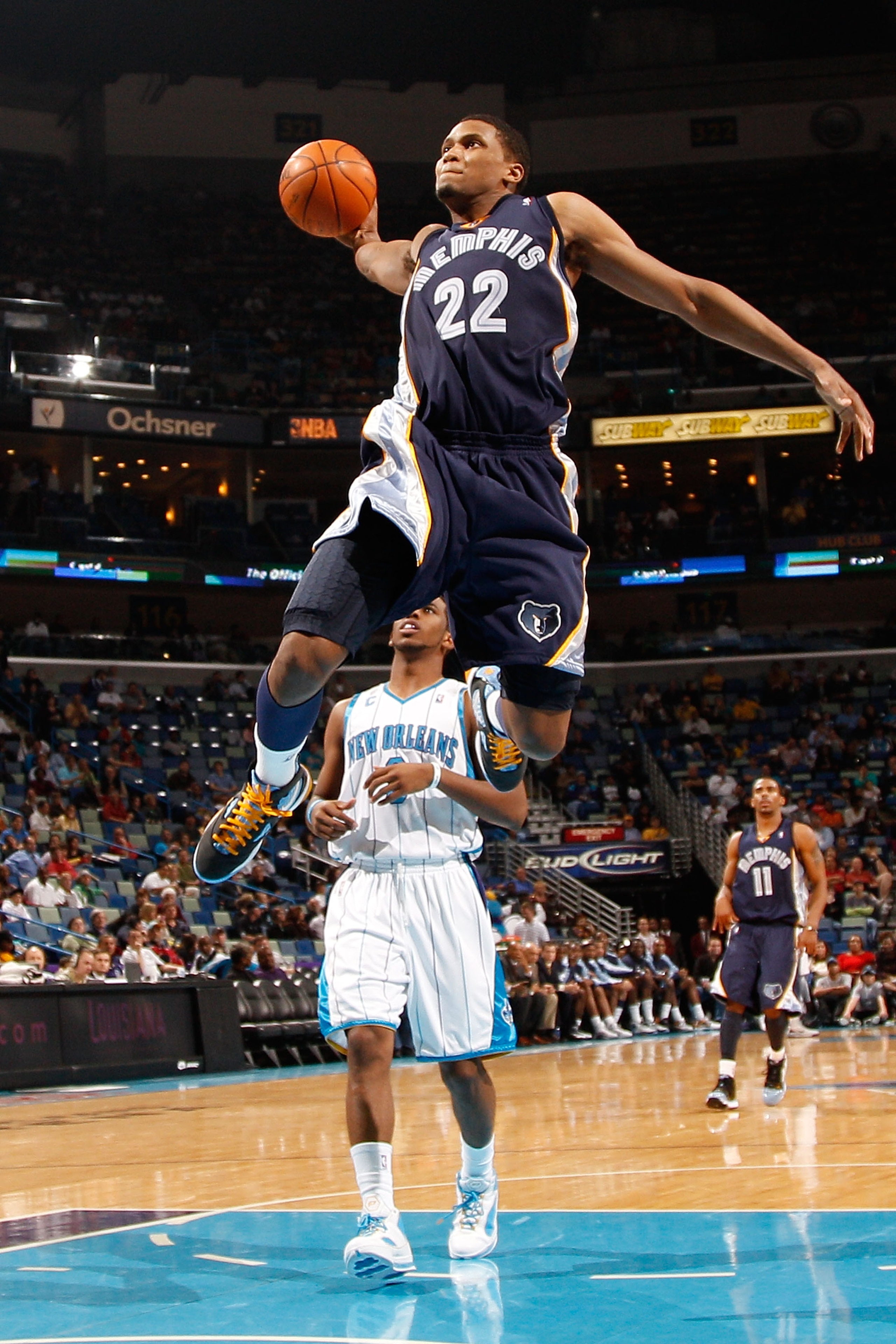 NEW ORLEANS - JANUARY 20:  Rudy Gay #22 of the Memphis Grizzlies goes up for a dunk over Chris Paul #3 of the New Orleans Hornets at the New Orleans Arena on January 20, 2010 in New Orleans, Louisiana.  The Hornets defeated the Grizzlies 113-111.  NOTE TO