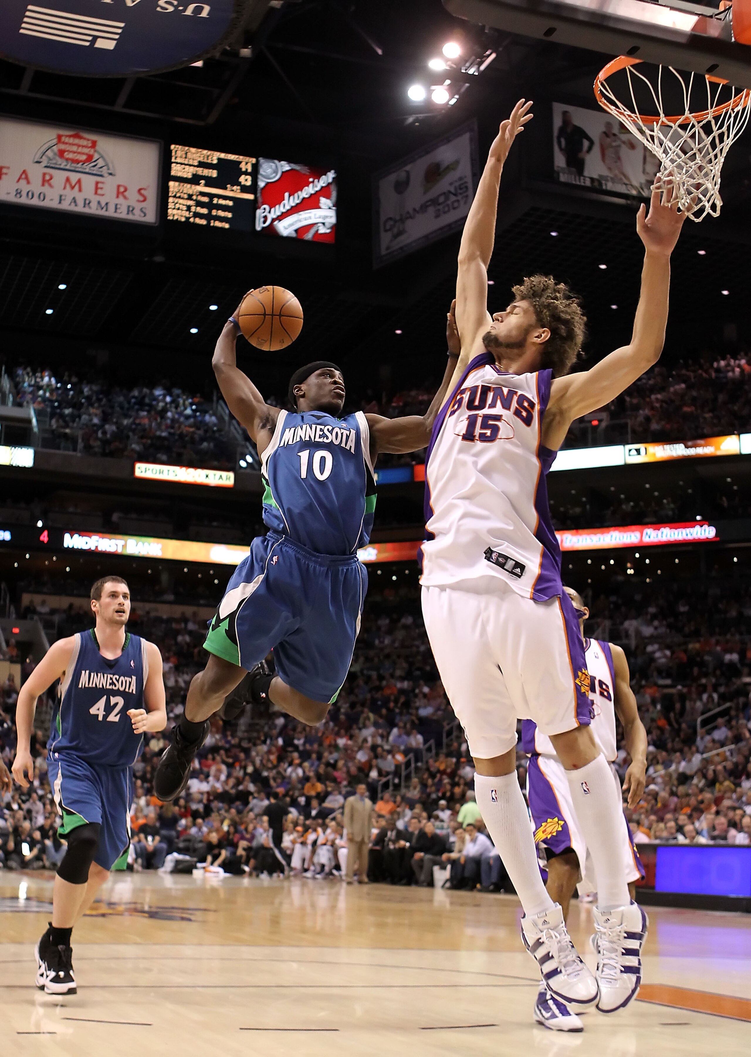 PHOENIX - MARCH 16:  Jonny Flynn #10 of the Minnesota Timberwolves drives to the basket against Robin Lopez #15 of the Phoenix Suns during the NBA game at US Airways Center on March 16, 2010 in Phoenix, Arizona. The Suns defeated the Timberwolves 152-114.