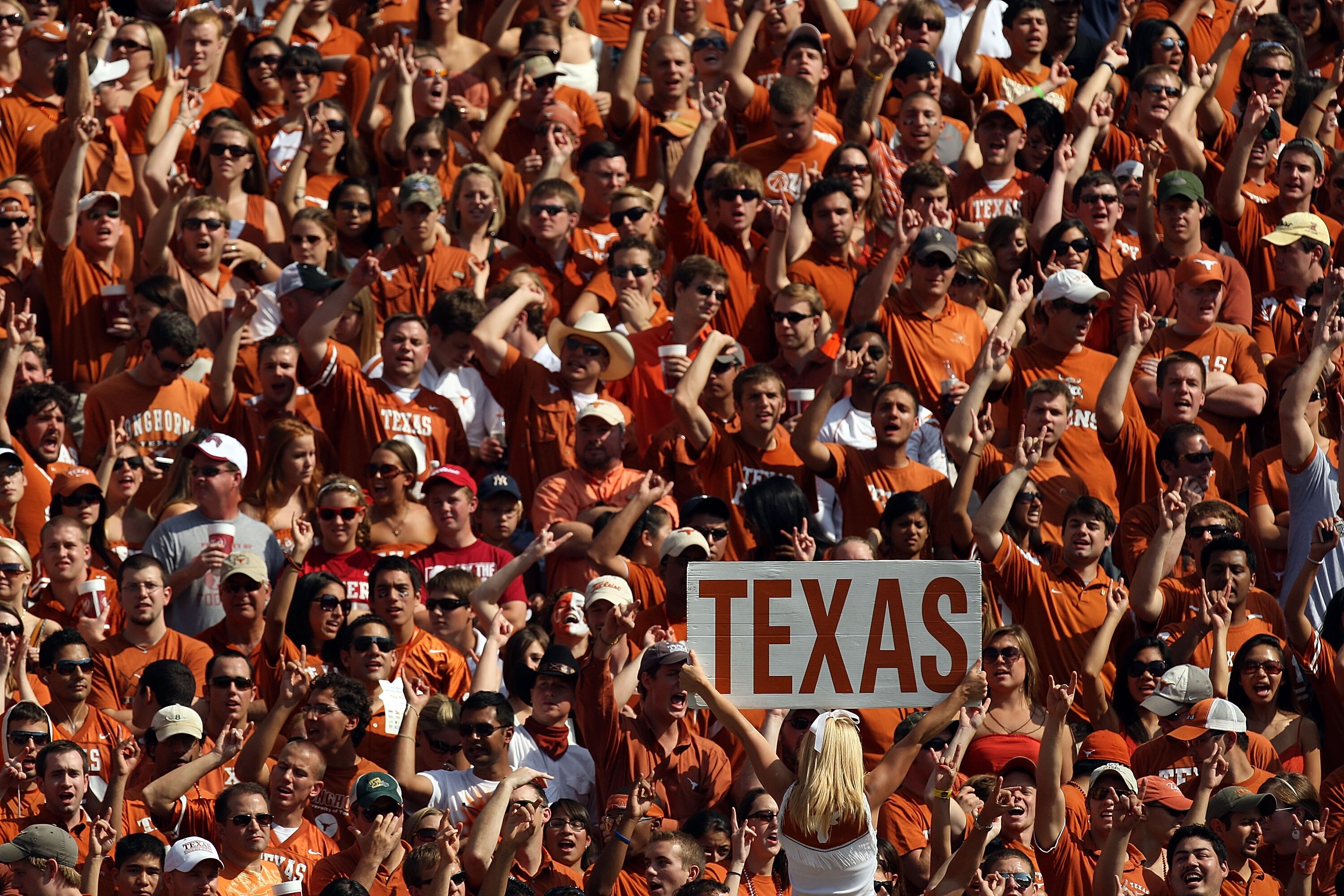 DALLAS - OCTOBER 11:  Texas Longhorns fans cheer during play against the Oklahoma Sooners at the Cotton Bowl on October 11, 2008 in Dallas, Texas.  (Photo by Ronald Martinez/Getty Images)