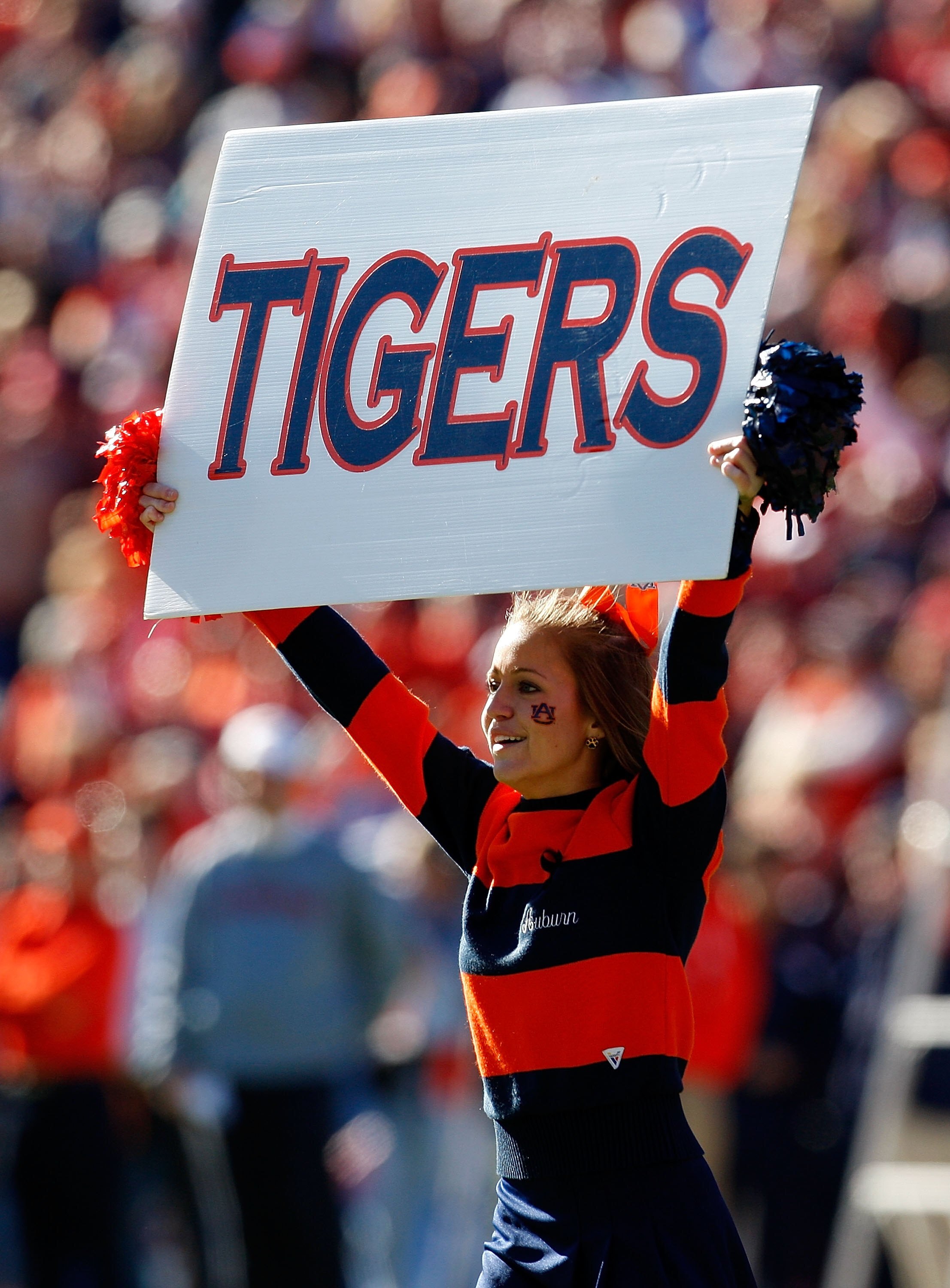 AUBURN, AL - NOVEMBER 27:  A cheerleader for the Auburn Tigers peforms before the game against the Alabama Crimson Tide at Jordan-Hare Stadium on November 27, 2009 in Auburn, Alabama.  (Photo by Kevin C. Cox/Getty Images)