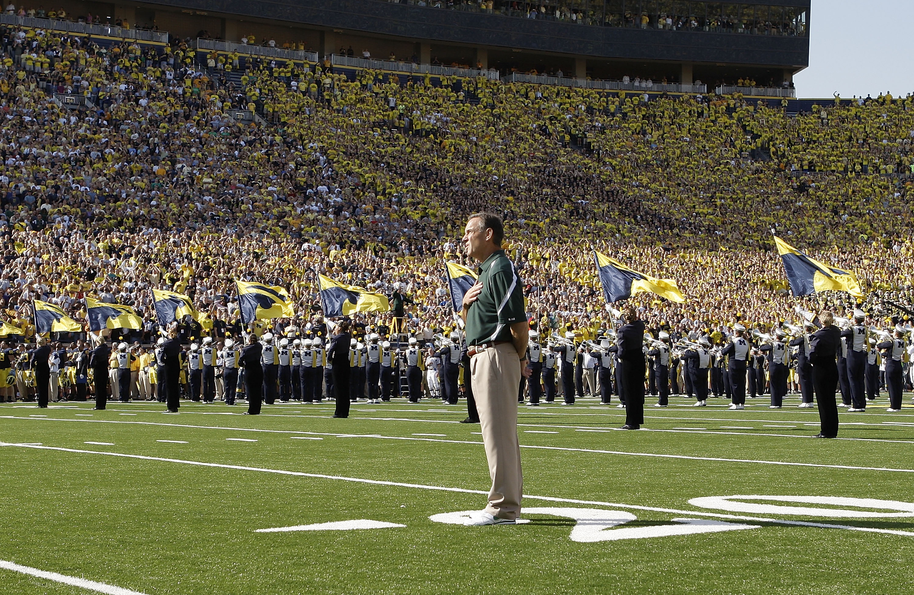 ANN ARBOR, MI - OCTOBER 09:  Michigan State head coach Mark Dantonio stands on the field for the National Anthem prior to the start of the game against the Michigan Wolverines October 9, 2010 at Michigan Stadium in Ann Arbor, Michigan. The Spartans defeat