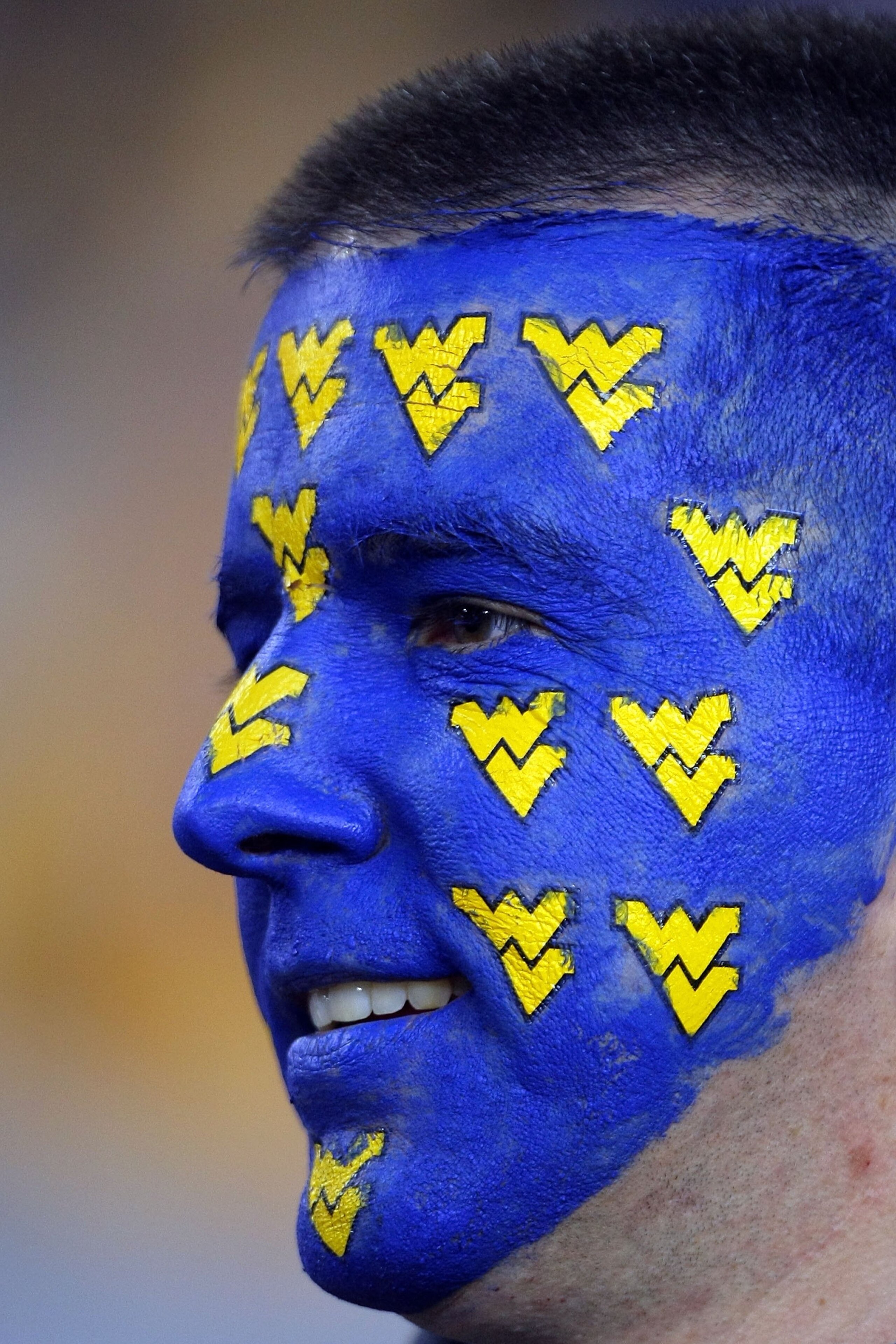 GLENDALE, AZ - JANUARY 02:  A West Virginia Mountaineers fan smiles before the Mountaineers take on the Oklahoma Sooners at the Tostito's Fiesta Bowl at University of Phoenix Stadium January 2, 2008 in Glendale, Arizona.  (Photo by Doug Pensinger/Getty Im