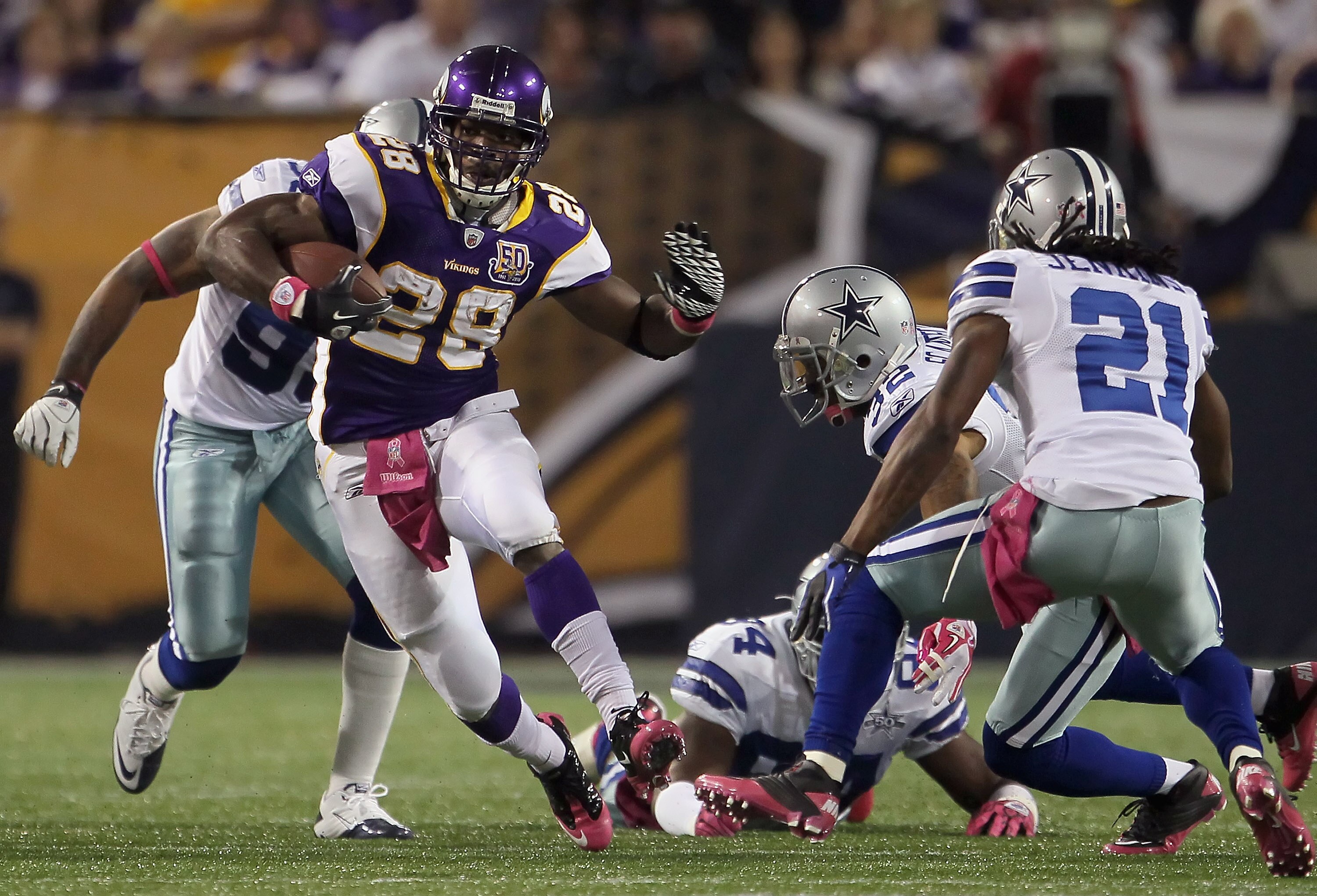 MINNEAPOLIS - OCTOBER 17:  Runningback Adrian Peterson #29 of the Minnesota Vikings carries the ball against the Dallas Cowboys during the first half at Mall of America Field on October 17, 2010 in Minneapolis, Minnesota.  (Photo by Jeff Gross/Getty Image