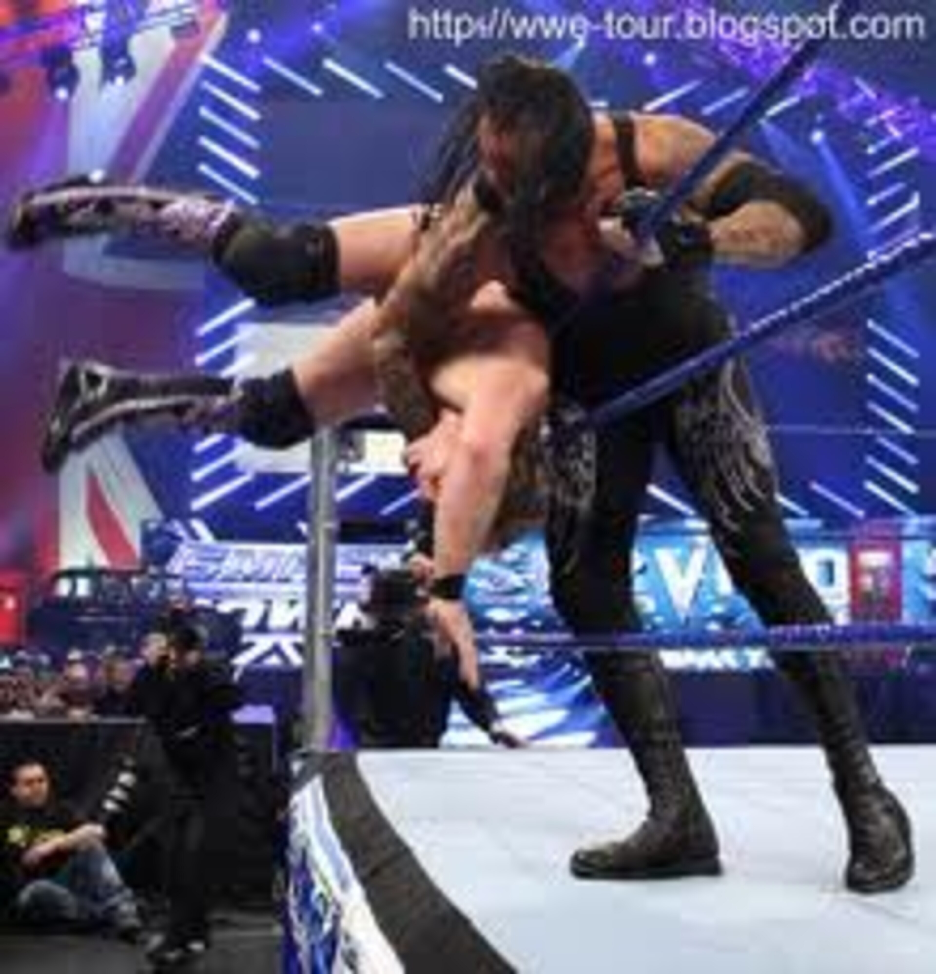Chris Jericho Takes A Spill Over the Top Rope