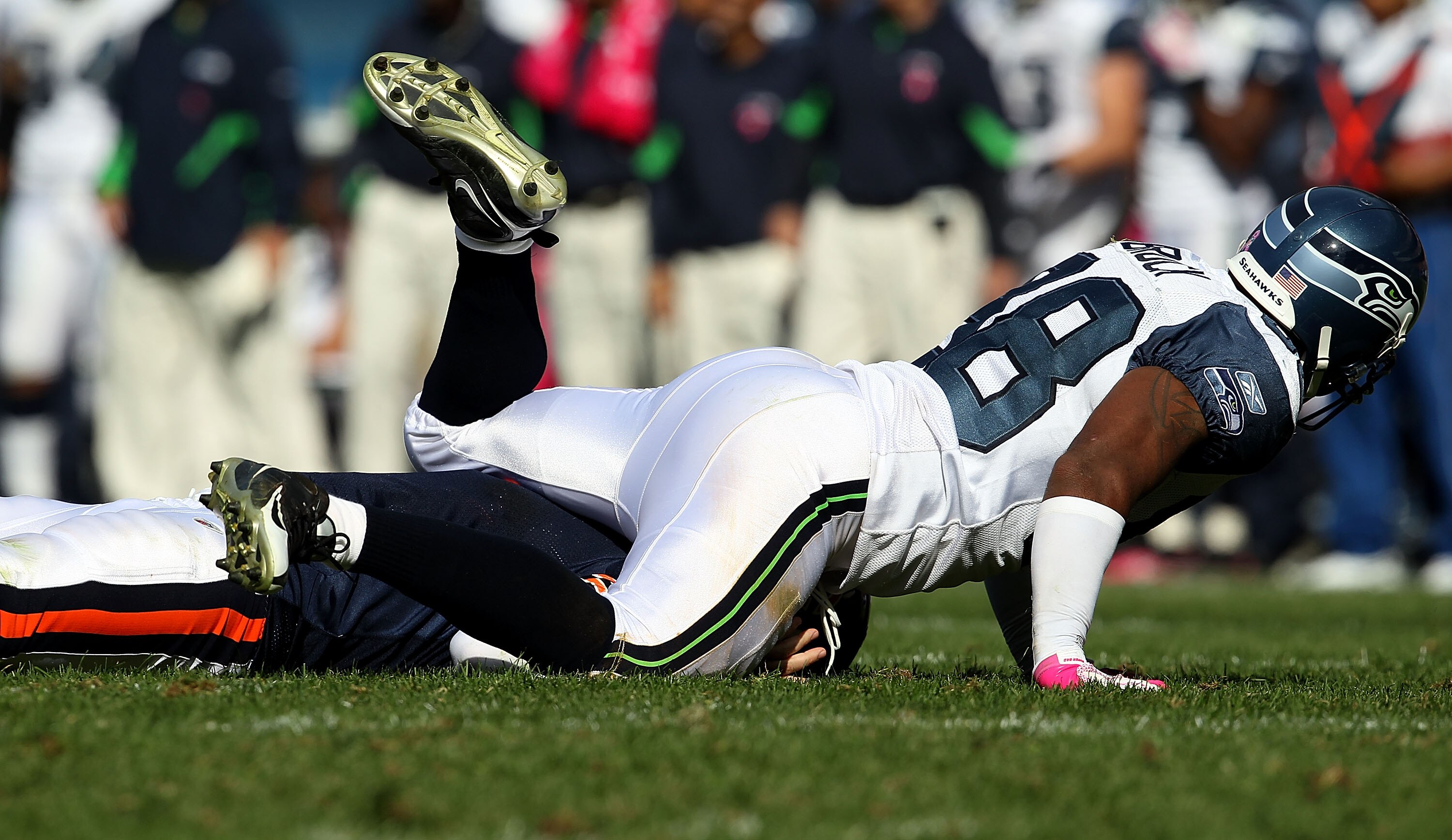 CHICAGO - OCTOBER 17: Jay Cutler #6 of the Chicago Bears is driven to the ground after throwing by Raheem Brock #98 of the Seattle Seahawks at Soldier Field on October 17, 2010 in Chicago, Illinois. The Seahawks defeated the Bears 23-20. (Photo by Jonatha