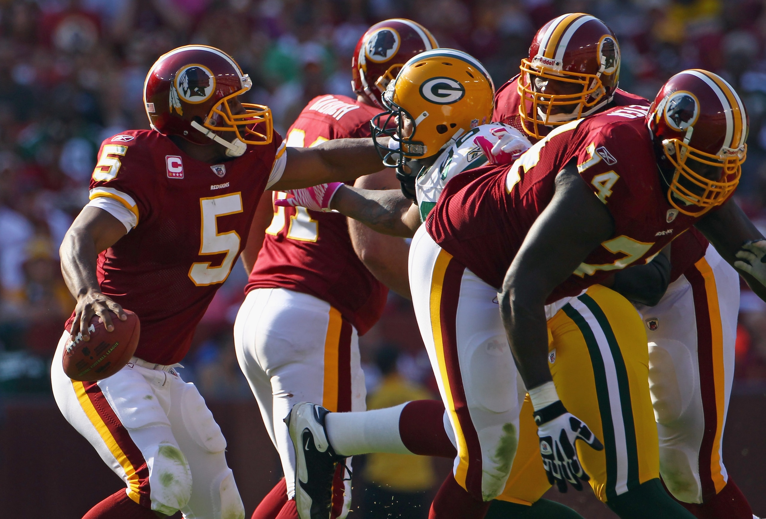 LANDOVER, MD - OCTOBER 10:  Donovan McNabb #5 of the Washington Redskins scrambles in the pocket against the Green Bay Packers at FedExField on October 10, 2010 in Landover, Maryland. The Redskins won the game in overtime 16-13.  (Photo by Win McNamee/Get