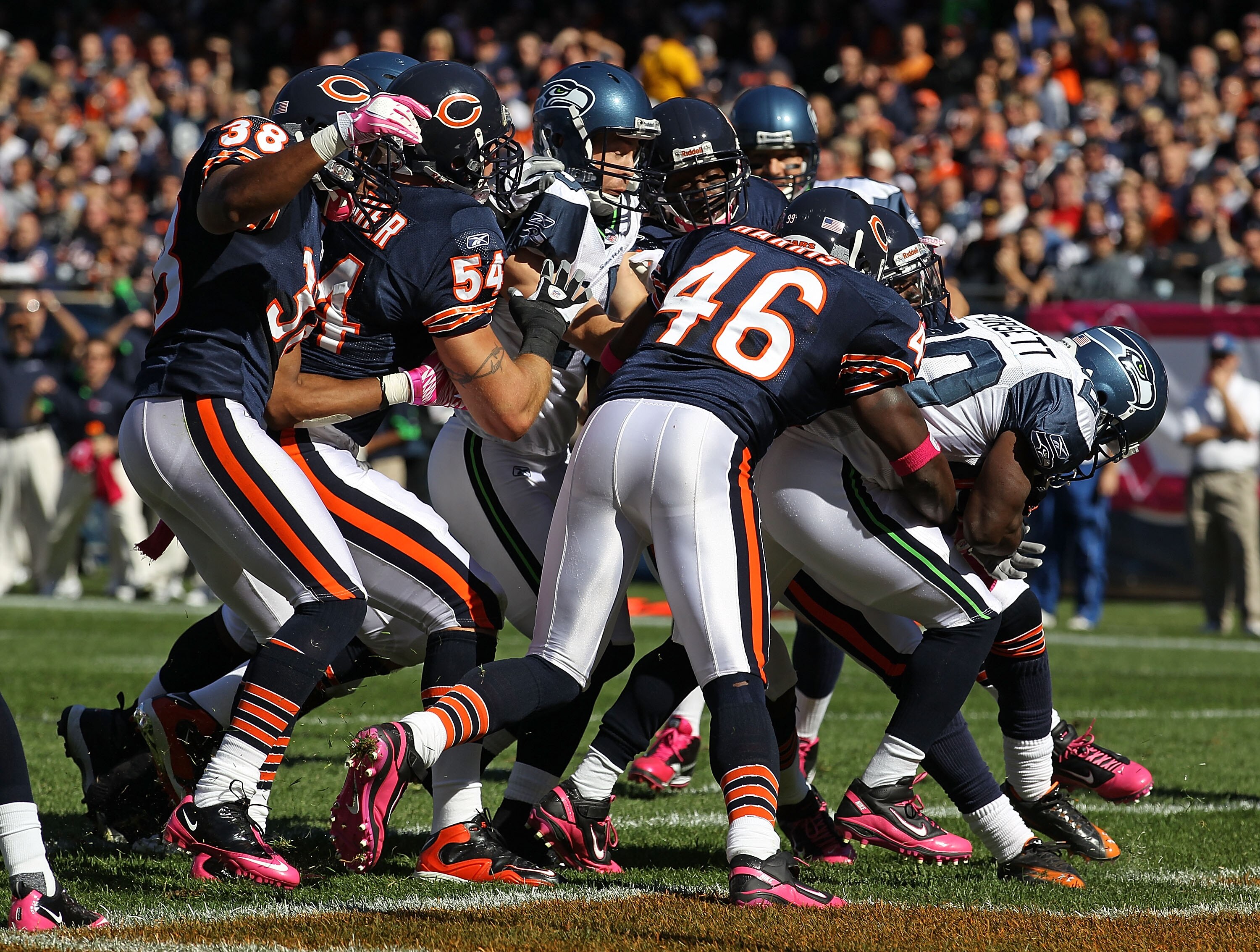 CHICAGO - OCTOBER 17: Justin Forsett #20 of the Seattle Seahawks scores a touchdown pursues by Chris Harris #46, Brian Urlacher #54 and Danieal Manning #38 of the Chicago Bears at Soldier Field on October 17, 2010 in Chicago, Illinois. The Seahawks defeat