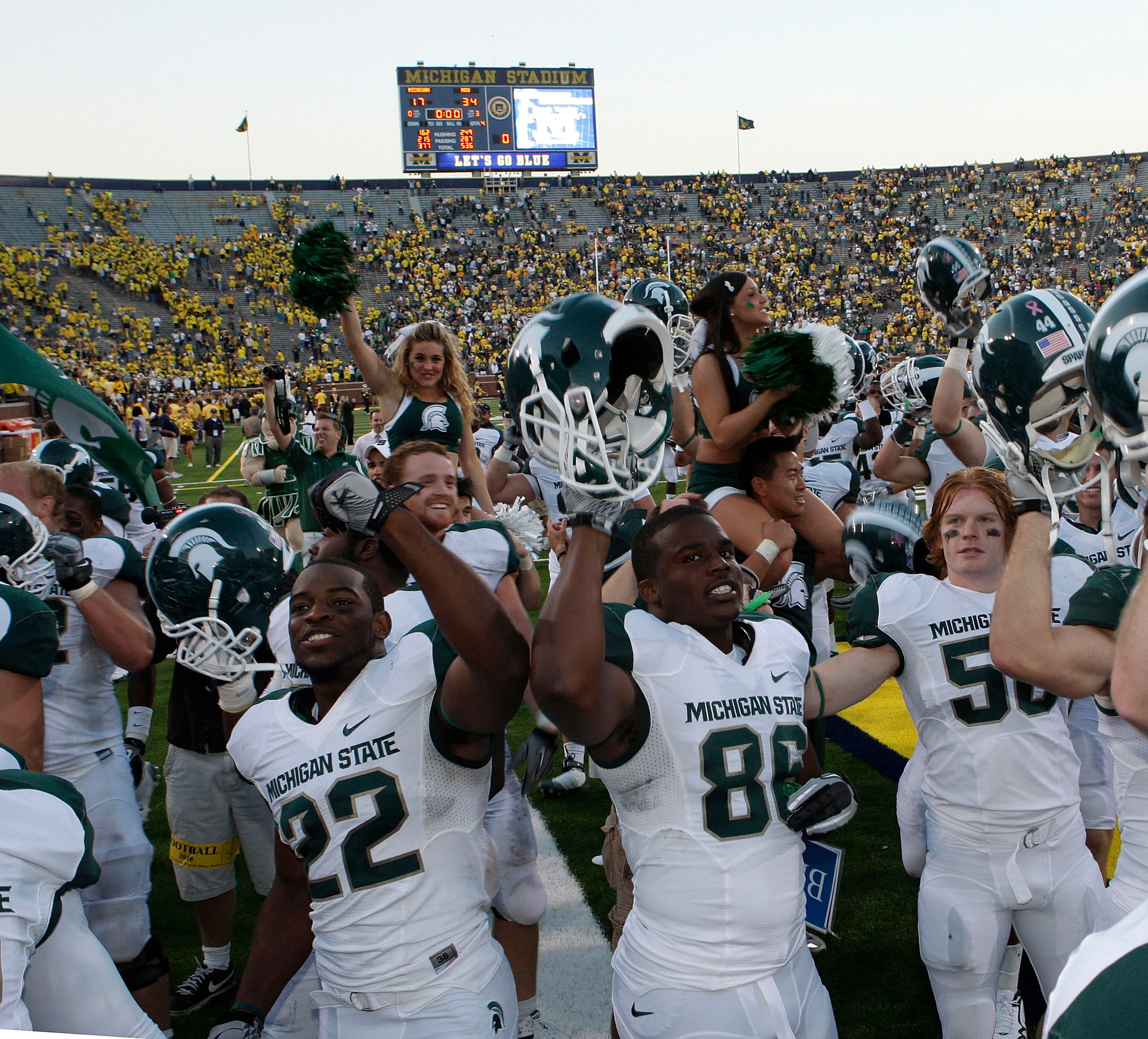 ANN ARBOR, MI - OCTOBER 09: Josh Bodell #22 and Fred Smith #86 of the Michigan State Spartans celebrate their win over the Michigan Wolverines 34-17 on October 9, 2010 at Michigan Stadium in Ann Arbor, Michigan. (Photo by Leon Halip/Getty Images)