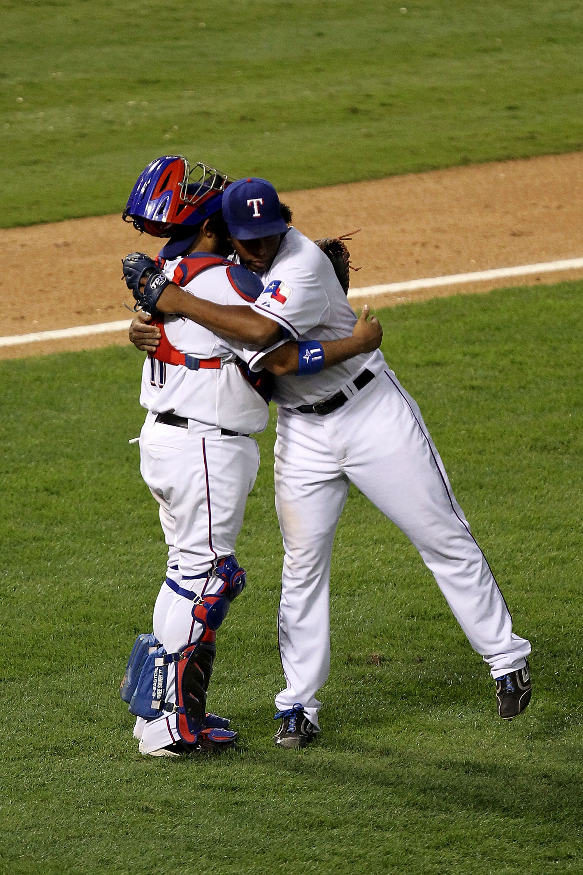 ARLINGTON, TX - OCTOBER 16:  (L-R) Bengie Molina #11 and Neftali Feliz #30 of the Texas Rangers celebrate after they won 7-2 against the New York Yankees in Game Two of the ALCS during the 2010 MLB Playoffs at Rangers Ballpark in Arlington on October 16,