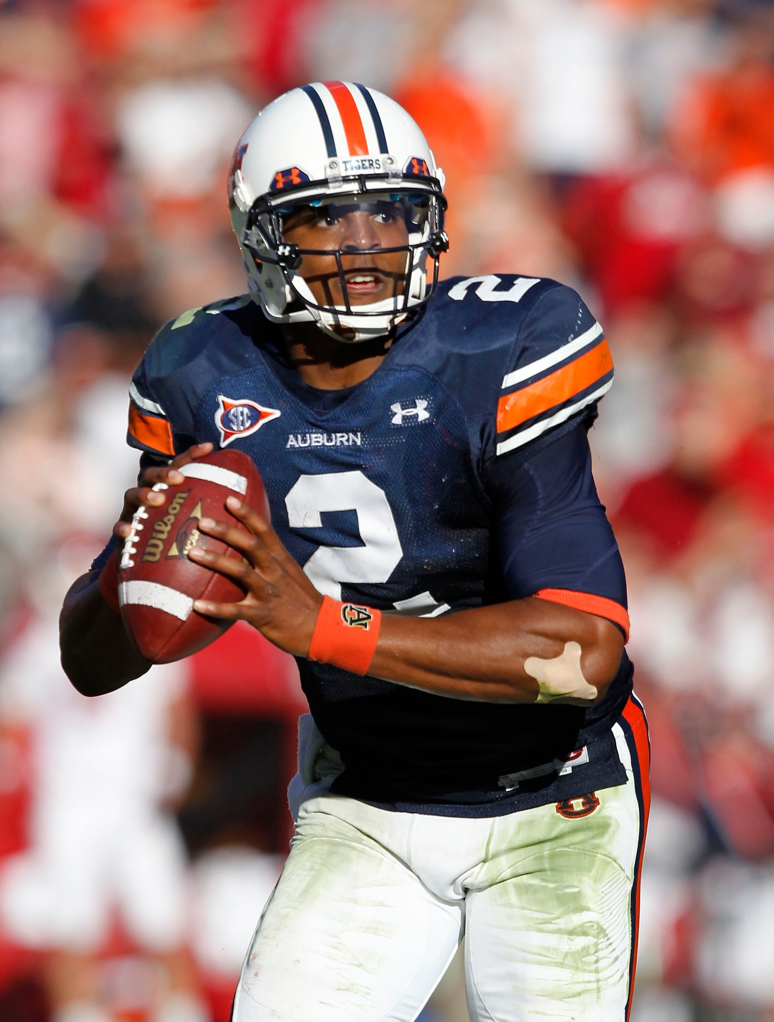 AUBURN, AL - OCTOBER 16:  Quarterback Cam Newton #2 of the Auburn Tigers rolls out during the game against the Arkansas Razorbacks at Jordan-Hare Stadium on October 16, 2010 in Auburn, Alabama.  (Photo by Mike Zarrilli/Getty Images)