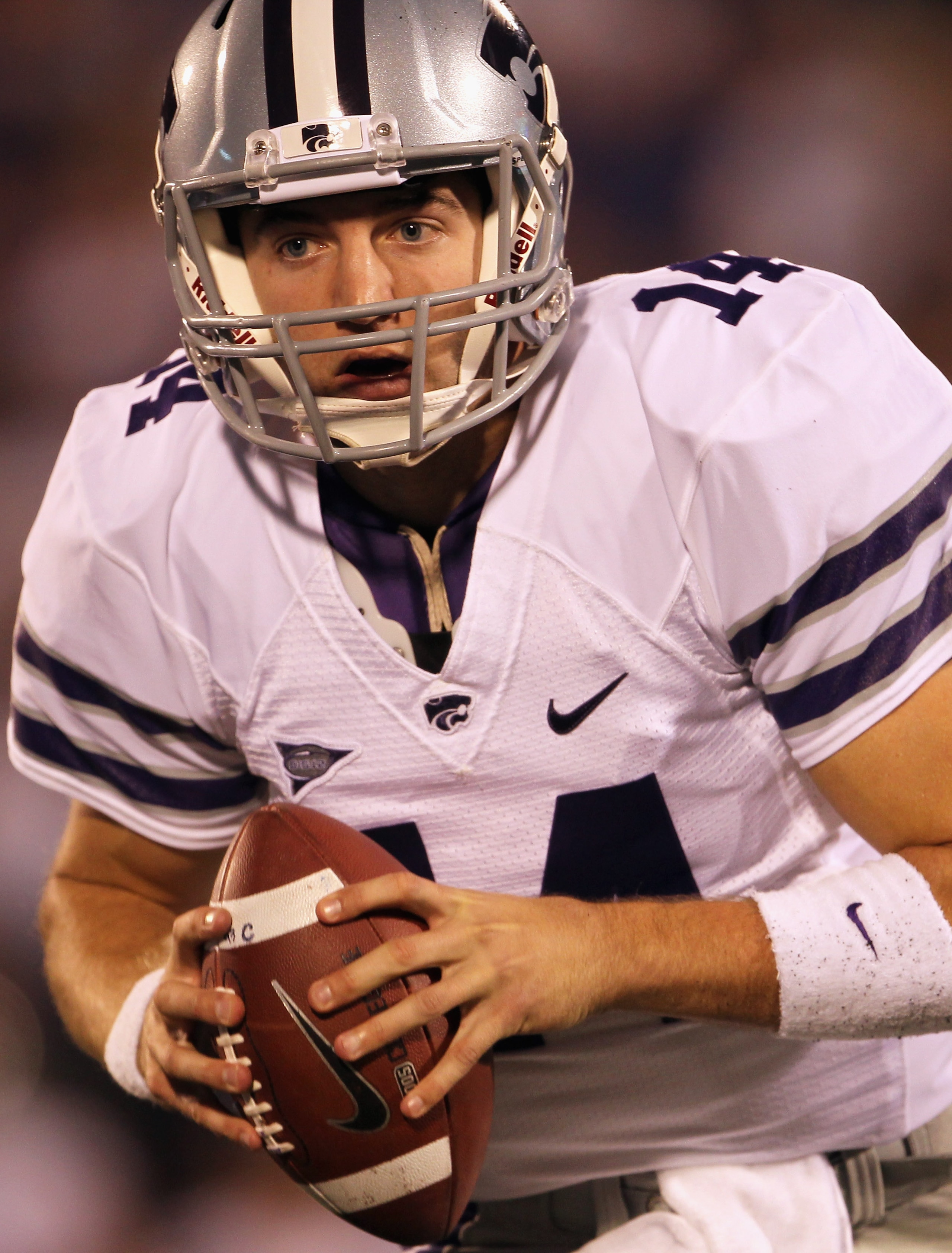 LAWRENCE, KS - OCTOBER 14:  Quarterback Carson Coffman #14 the Kansas State Wildcats carries the ball during the game against the Kansas Jayhawks on October 14, 2010 at Memorial Stadium in Lawrence, Kansas.  (Photo by Jamie Squire/Getty Images)