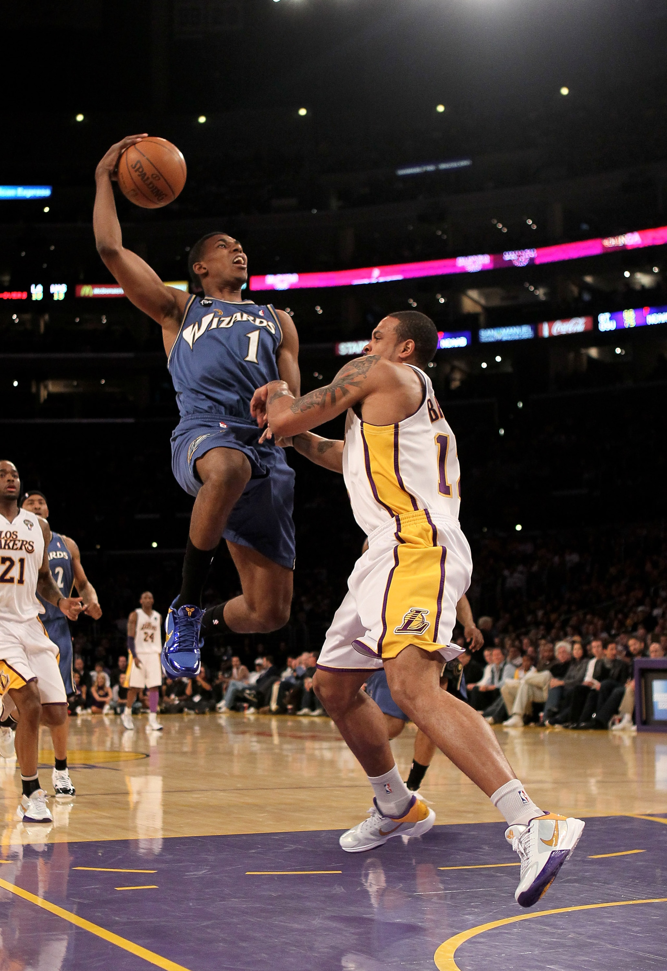 LOS ANGELES, CA - MARCH 21:  Nick Young #1 of the Washington Wizards goes up for a shot against Shannon Brown #12 of the Los Angeles Lakers on March 21, 2010 at Staples Center in Los Angeles, California.  The Lakers won 99-92.  NOTE TO USER: User expressl