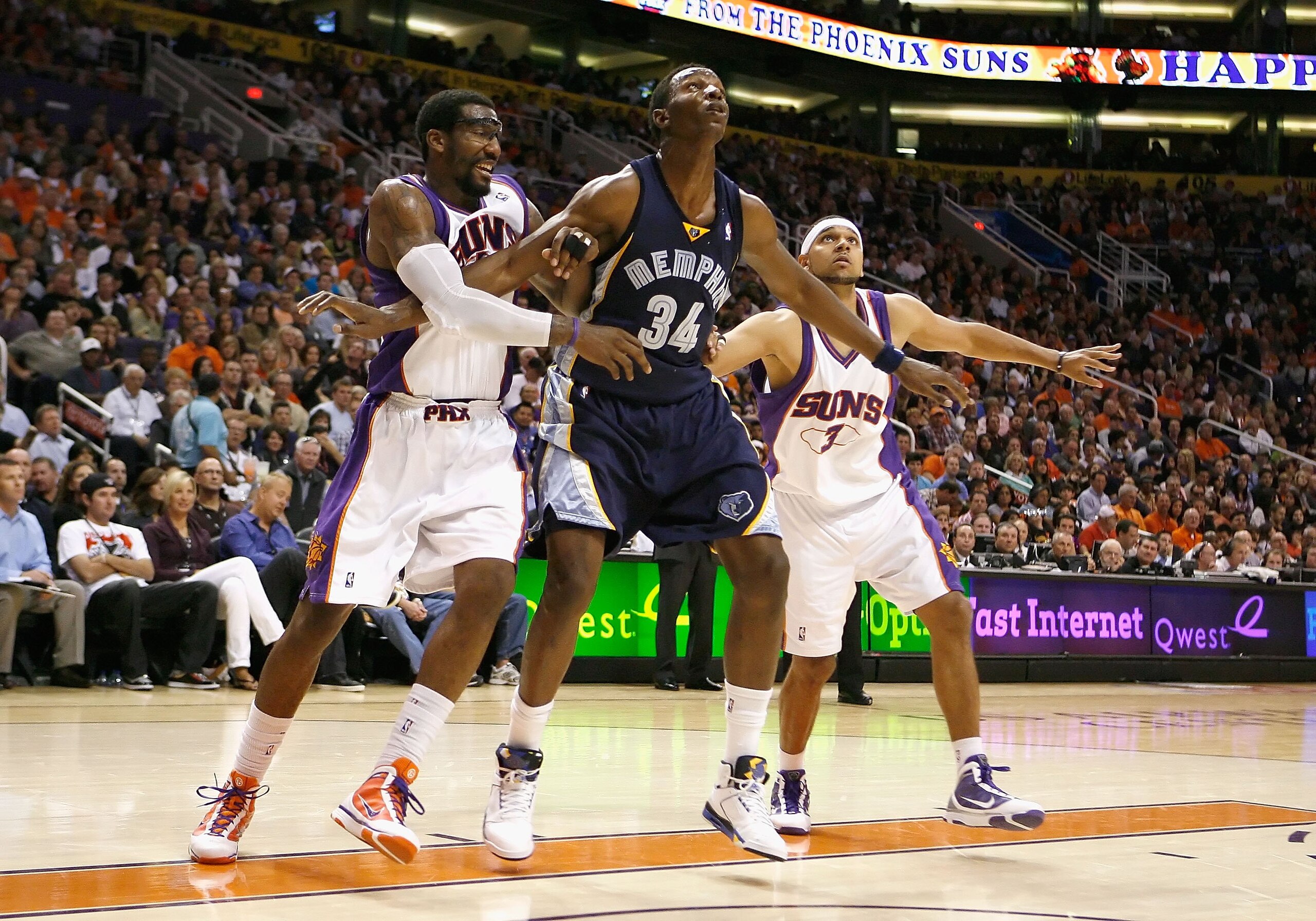 PHOENIX - NOVEMBER 25:  Hasheem Thabeet #34 of the Memphis Grizzlies blocks out Amar'e Stoudemire #1 and Jared Dudley #3 of the Phoenix Suns during the NBA game at US Airways Center on November 25, 2009 in Phoenix, Arizona.  The Suns defeated the Grizzlie