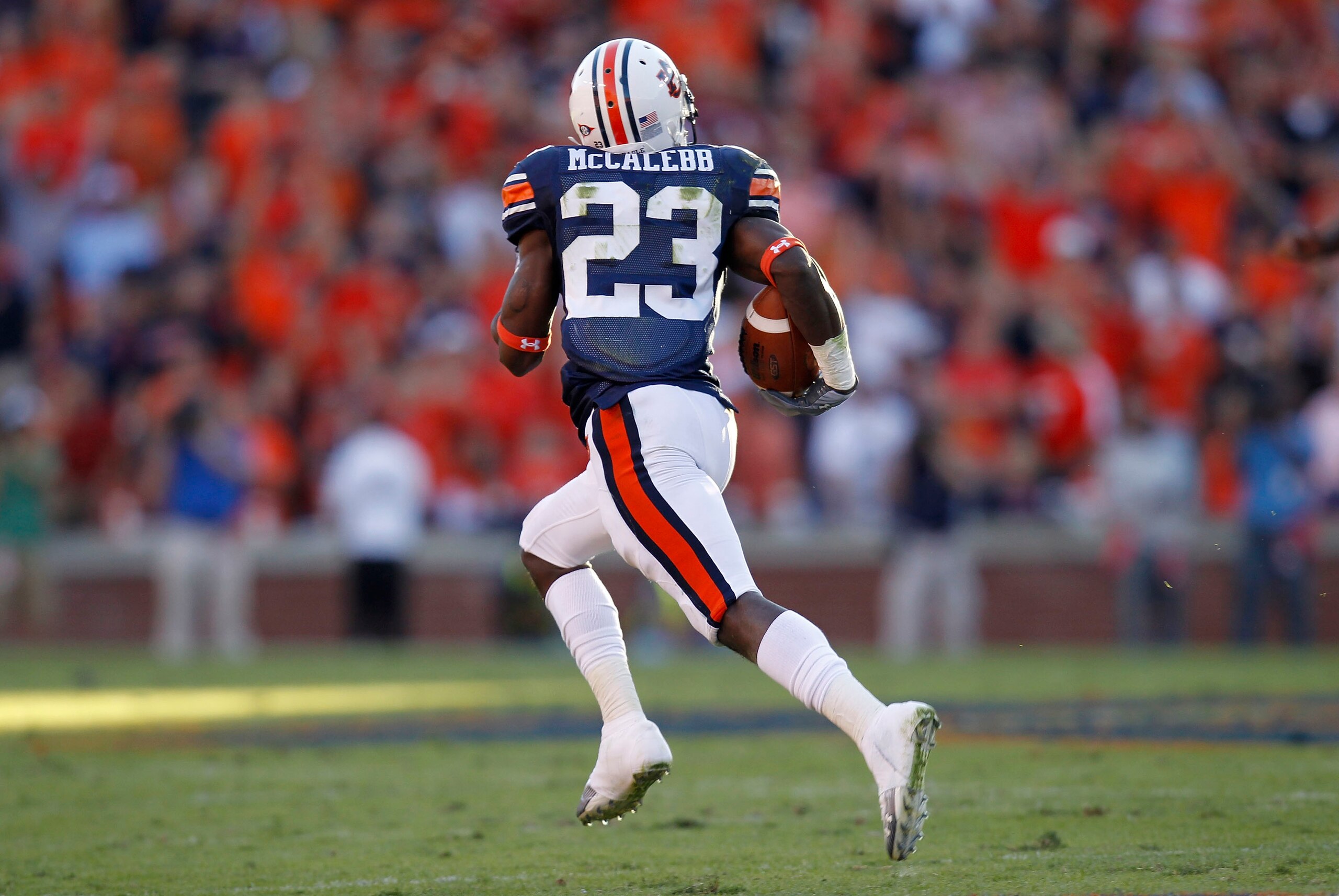 AUBURN - OCTOBER 16:  Kick returner Onterio McCalebb of the Auburn Tigers runs for a 99 yard kick return during the game against the Arkansas Razorbacks at Jordan-Hare Stadium on October 16, 2010 in Auburn, Alabama.  The Tigers beat the Razorbacks 65-43.
