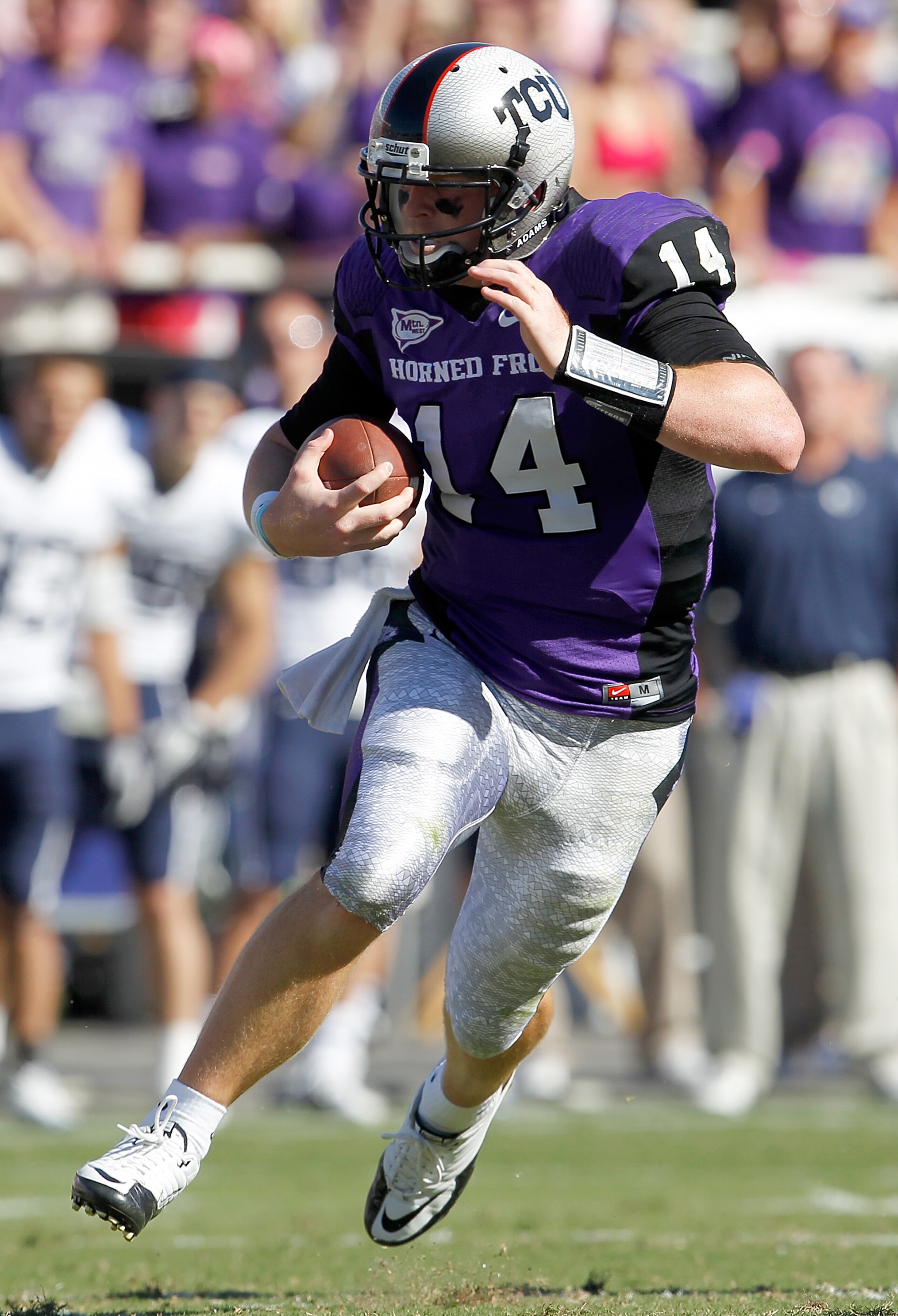 FORT WORTH, TX - OCTOBER 16: Quarterback Andy Dalton #14 of the TCU Horned Frogs scrambles with the ball against the BYU Cougars at Amon G. Carter Stadium on October 16, 2010 in Fort Worth, Texas. TCU beat BYU 31-3. (Photo by Tom Pennington/Getty Images FORT WORTH, TX - OCTOBER 16: Quarterback Andy Dalton #14 of the TCU Horned Frogs scrambles with the ball against the BYU Cougars at Amon G. Carter Stadium on October 16, 2010 in Fort Worth, Texas. TCU beat BYU 31-3. (Photo by Tom Pennington/Getty Images